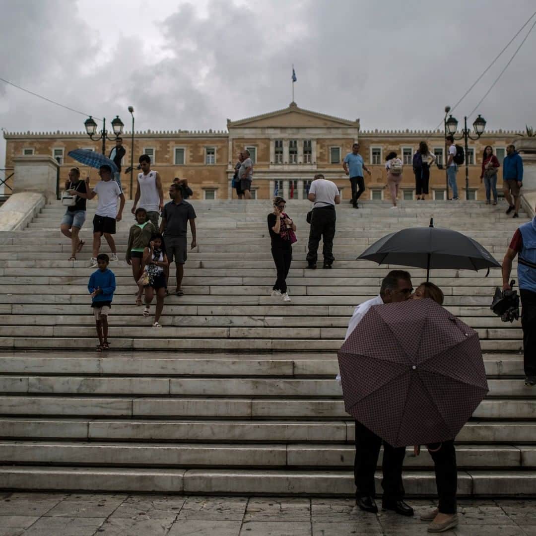 National Geographic Travelさんのインスタグラム写真 - (National Geographic TravelInstagram)「Photo by Muhammed Muheisen @mmuheisen | On a rainy day in Syntagma Square in Athens, Greece. For more photos and videos from different parts of the world, follow me @mmuheisen and @mmuheisenpublic #muhammedmuheisen #Greece #Athens」6月4日 13時26分 - natgeotravel