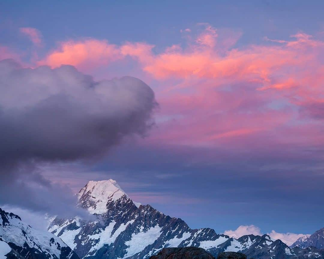 National Geographic Travelさんのインスタグラム写真 - (National Geographic TravelInstagram)「Photo @stephen_matera | Clouds hover over Mt. Cook/Aoraki and the Southern Alps at sunset, South Island, New Zealand. The Southern Alps are a heavily glaciated range that runs through the spine of the South Island of New Zealand, with Mt. Cook/Aoraki as the highest peak in New Zealand at 12,218 ft (3,724 meters). The Southern Alps have over 3,000 glaciers, the longest, the Tasman Glacier, is 18 miles (29 km) in length. Follow me @stephen_matera  for more images like this from New Zealand and around the world. #southernalps #mtcook #aoraki #glacier」6月4日 19時12分 - natgeotravel