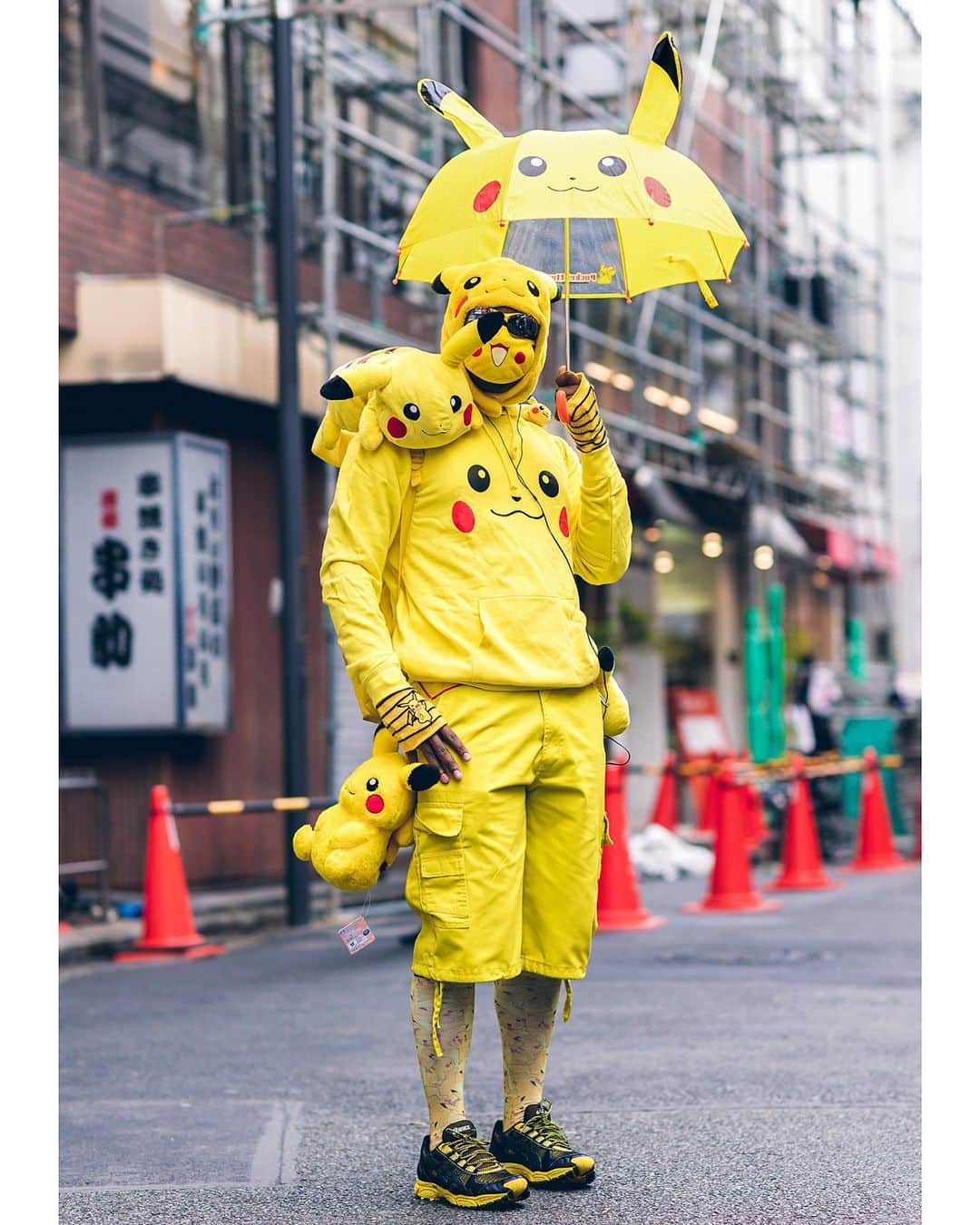 Harajuku Japanさんのインスタグラム写真 - (Harajuku JapanInstagram)「J. on the street in Harajuku wearing a Pikachu inspired street style featuring a Pikachu umbrella, Pikachu face mask, plushies, backpack, tights, and tail along with matching yellow and black Asics sneakers.」6月6日 16時05分 - tokyofashion