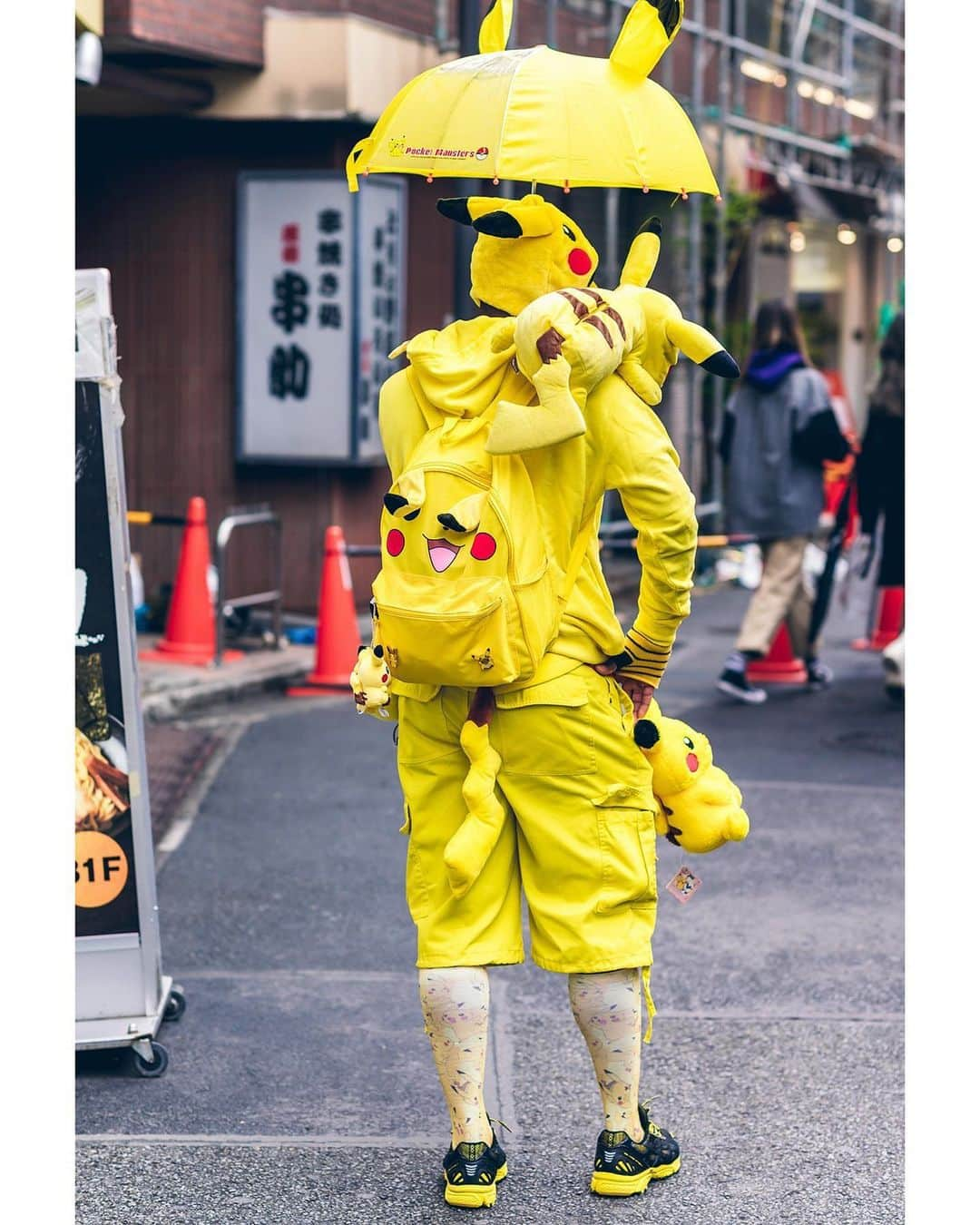 Harajuku Japanさんのインスタグラム写真 - (Harajuku JapanInstagram)「J. on the street in Harajuku wearing a Pikachu inspired street style featuring a Pikachu umbrella, Pikachu face mask, plushies, backpack, tights, and tail along with matching yellow and black Asics sneakers.」6月6日 16時05分 - tokyofashion