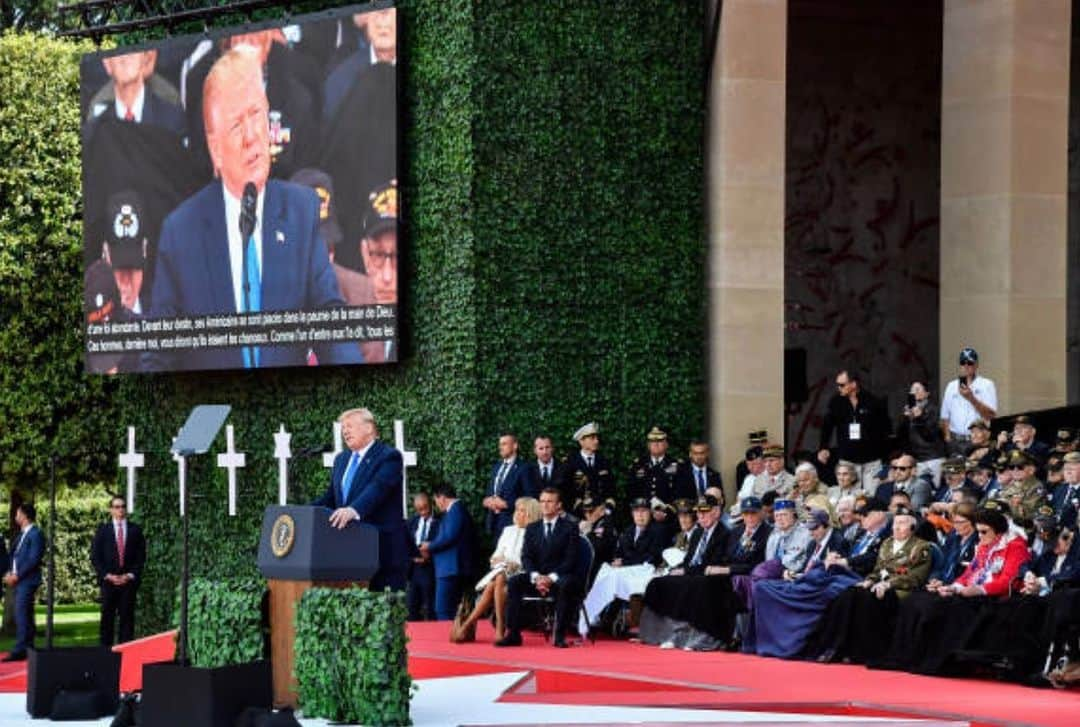 ドナルド・トランプさんのインスタグラム写真 - (ドナルド・トランプInstagram)「U.S. President Donald Trump, left, speaks from the podium as Emmanuel Macron, France's president, center, and his wife Brigitte Macron sit with World War II veterans during a ceremony at the Normandy American Cemetery and Memorial in Colleville-sur-Mer, France, on Thursday, June 6, 2019. President Donald Trump's European sojourn continues with a visit to France for the 75th anniversary of the D-Day landings. Photographer: Geert Vanden Wijngaert/Bloomberg via Getty Images」6月7日 0時09分 - realdonaldtrump