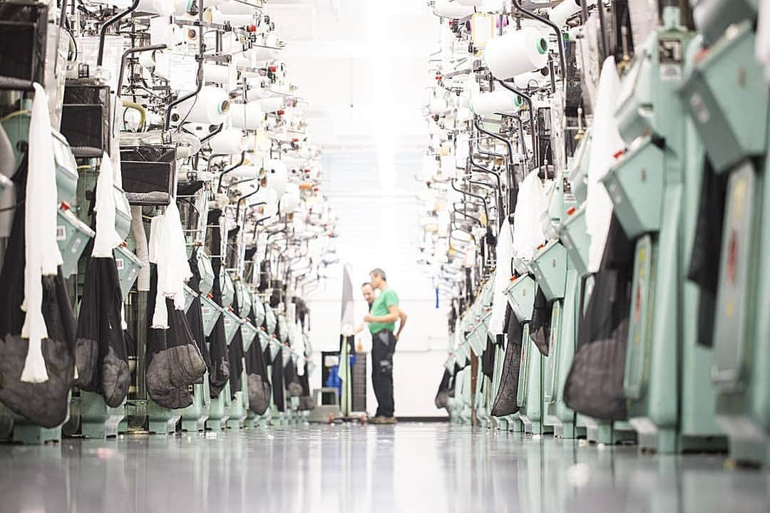 ウォルフォードさんのインスタグラム写真 - (ウォルフォードInstagram)「Take a look at the inside of our production facility at our HQ in Bregenz, Austria. This is where we produce our iconic tights and skinwear.  Nerd Facts 🧠 1. To meet our high quality standards 1 pair of tights is checked 7 times before it leaves the production. 2. We have our own water treatment plant in order to clean and recycle the water used for our production. 3. We have voluntarily signed a target agreement with klimaaktiv, a climate protection initiative of the Austrian Federal Ministry of Agriculture, Forestry, Environment and Water Management. To date, Wolford has already introduced hot water and steam systems that resulted in an annual reduction of 300 tones of CO2.  #Wolfordbeyondnextseason 💚🌱」6月7日 0時25分 - wolford