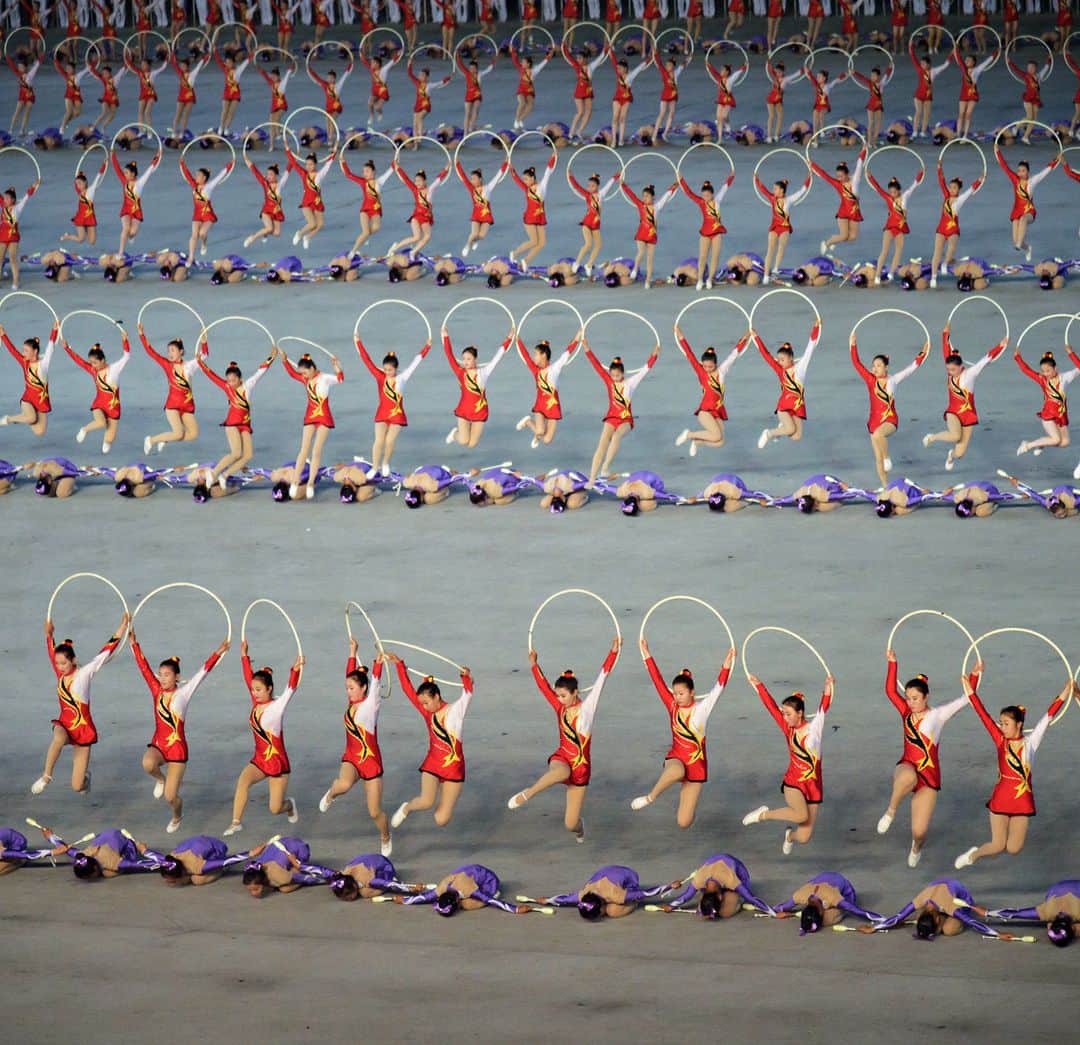 のインスタグラム：「AFP Photo 📷 KIM Won Jin - A photo taken on June 4, 2019 shows performers during a 'Grand Mass Gymnastics and Artistic Performance', or mass games, at the May Day stadium in Pyongyang. The "Grand Mass Gymnastics and Artistic Performance" features enormous numbers of people -- mostly students and children -- performing synchronised moves. Tens of thousands of performers in Pyongyang took part in the first of North Korea's spectacular "Mass Games" propaganda displays for 2019, but the show left leader Kim Jong Un unimpressed. #MassGames #Gymnastics #Gymnastic」