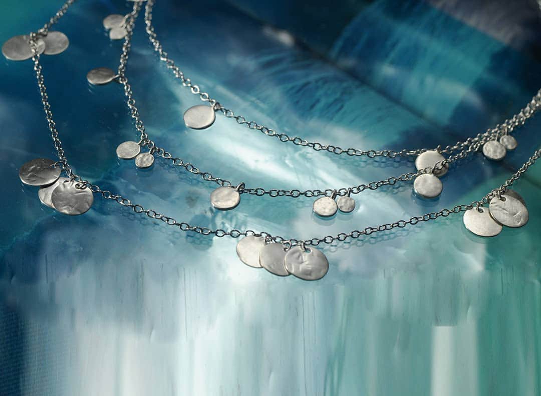 のインスタグラム：「“Every craftsman searches for what’s not there. “- Rumi, 11th C. poet The art of adornment echoes this timeless wisdom. We all have gifts that give us purpose. A pesky weed can bare magically medicinal flowers. These handmade sterling silver chains send out the vibrations that were carefully hammered into them by our craftsman. Like florets at the center of a bloom, every mark in their precious metal is a lifetime in the making. Our signature matte finish distinguishes these round realms of silver, for a confident understated look.」