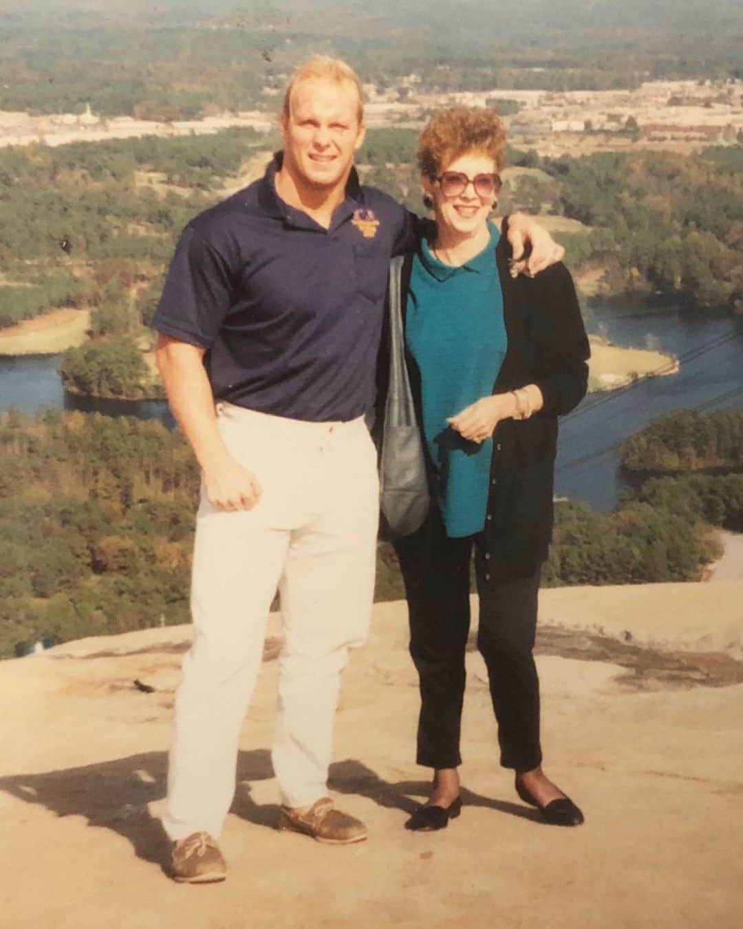 ストーン・コールド・スティーブ・オースチンのインスタグラム：「Stunning Steve Austin and Mom at Stone Mountain Georgia right after the ‘American Dream’ Dusty Rhodes hired me in Atlanta for World Championship Wrestling. Dusty was the booker at this time and said he saw ‘potential’ in me as a young heel. Dusty was one of the main reasons I fell in love with wrestling. His presence and influence on the business will never die. #tbt」