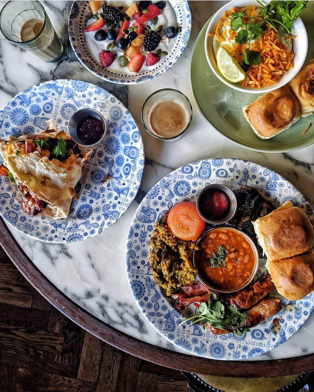 @LONDON | TAG #THISISLONDONさんのインスタグラム写真 - (@LONDON | TAG #THISISLONDONInstagram)「@clerkenwellboyec1 says... Officially THE BEST #BREAKFAST EVER! 😋 After an intensive bacon judging session last month, I'm loving @Dishoom's NEW breakfast menu || Double bacon naan with oozy fried egg 🥓🥓🍳, soy based keema per eedu 🔥, the Big Bombay (with all the trimmings) plus coconut yogurt with fresh fruit and BOTTOMLESS CHAI ✨ .... There's also the Wrestler's Naan for anyone still hungry (an extra huge portion of bacon, sausage and egg naan) 🏆💪🏻 TAG your Breakfast Crew and GO! 🌞🔥🥓🍳✨💯❤️ . . . #Friday #Dishoom #Shoreditch #Love #London #ThisIsLondon #londonlife #londonfood」6月7日 21時04分 - london