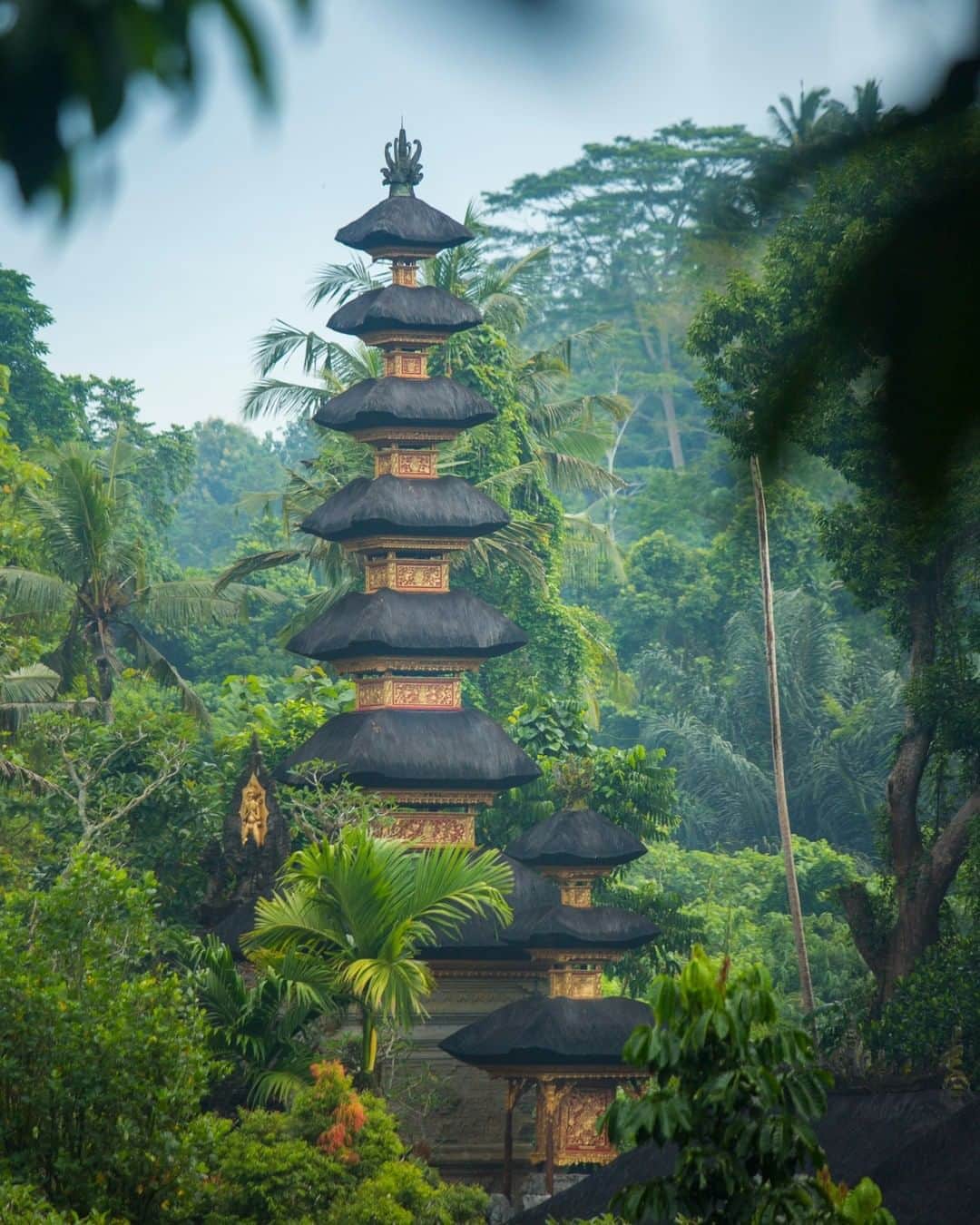 National Geographic Travelさんのインスタグラム写真 - (National Geographic TravelInstagram)「Photo by @emilypolar | A Meru tower is the principal shrine of a Balinese temple. It is a wooden pagoda-like structure with multi-tiered thatched roofs made from ijuk fibers of the Arenga pinnata, a feather palm tree. These towers are identified with the Mount Meru of Hindu mythology, the abode of the Hindu gods. The number of roofs is always odd and reflects which deity, local pantheon or deified person the shrine is dedicated to. To see more of Bali and beyond follow me @emilypolar #Bali #Indonesia  #Hinduism #PuraGunungLebah」6月9日 1時02分 - natgeotravel
