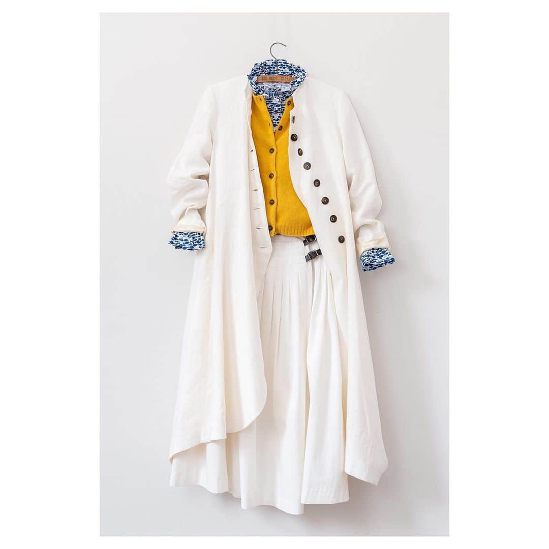 キャベジズ&ローゼズのインスタグラム：「All Things Bright and Beautiful ✨☀️Tap to shop one of our favourite ensembles of the season. The Swirly Panel Coat in soft white linen looks lovely when worn with the Grace Cardigan knit in Scotland, the Frederika Shirt and the Priory Kilt coming soon👉Swipe to shop👈#allnew #fortheloveoflinen #yellowcardigan #madeinlondon #slowfashion #printedshirts #sustainableluxurybrand #sustainablefashion #cabbagesandroses #cabbagesandrosesfashion @christina_strutt @cabbagesandroses_shop 👆Link In Bio👆」