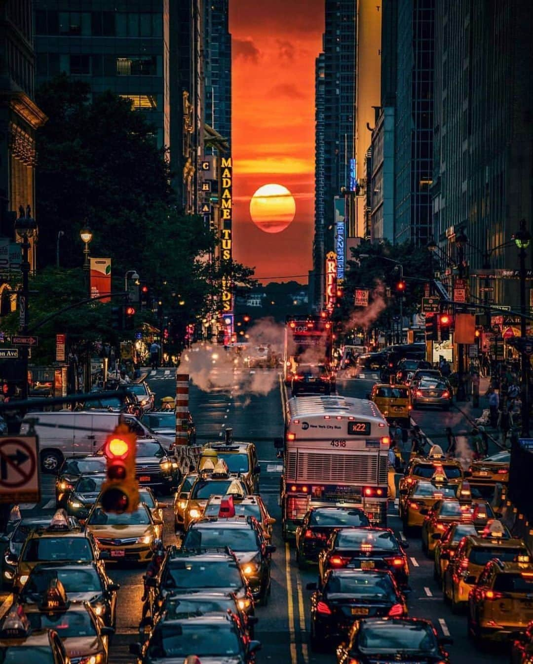 Canon Photographyさんのインスタグラム写真 - (Canon PhotographyInstagram)「In perfect alignment. Manhattanhenge, also called the Manhattan Solstice, is an event during which the setting sun or the rising sun is aligned with the east–west streets of the main street grid of Manhattan. The sunsets and sunrises each align twice a year, on dates evenly spaced around the summer solstice and winter solstice. The sunset alignment occurs around May 28 and around July 13. The sunrise alignment occurs around December 5 and around January 8. Photography | @ferraro112  #newyork #sunset #alignment #fireball #newyorkstyle #streetphotography #skyscraper #manhattanhenge」6月9日 7時33分 - cpcollectives