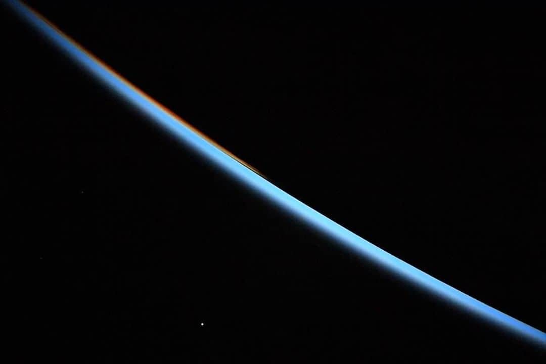 NASAさんのインスタグラム写真 - (NASAInstagram)「And then it dawned on us: that bright dot in the bottom left is our sister planet.  From aboard the @iss, @astro_christina captured this sunrise shot of Venus hovering over the serene, blue glow of Earth's atmosphere. Astronauts aboard the space station experience 16 sunrises and 16 sunsets every day, giving them the chance to get spectacular images like this one.⁣ ⁣ Credit: NASA/@astro_christina⁣ ⁣ #iss #spacestation #space #venus #sunrise #nasa」6月10日 0時09分 - nasa