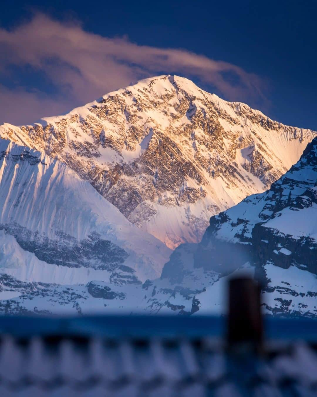 National Geographic Travelさんのインスタグラム写真 - (National Geographic TravelInstagram)「Photo by @emilypolar | A teahouse stokes the fire for guests sitting inside while Gangapurna on the Annapurna Massif puts on a pretty good show at dusk. To see more of Nepal and beyond follow @emilypolar #Nepal #Annapurna #Gangapurna #Manangdistrict」6月10日 22時06分 - natgeotravel