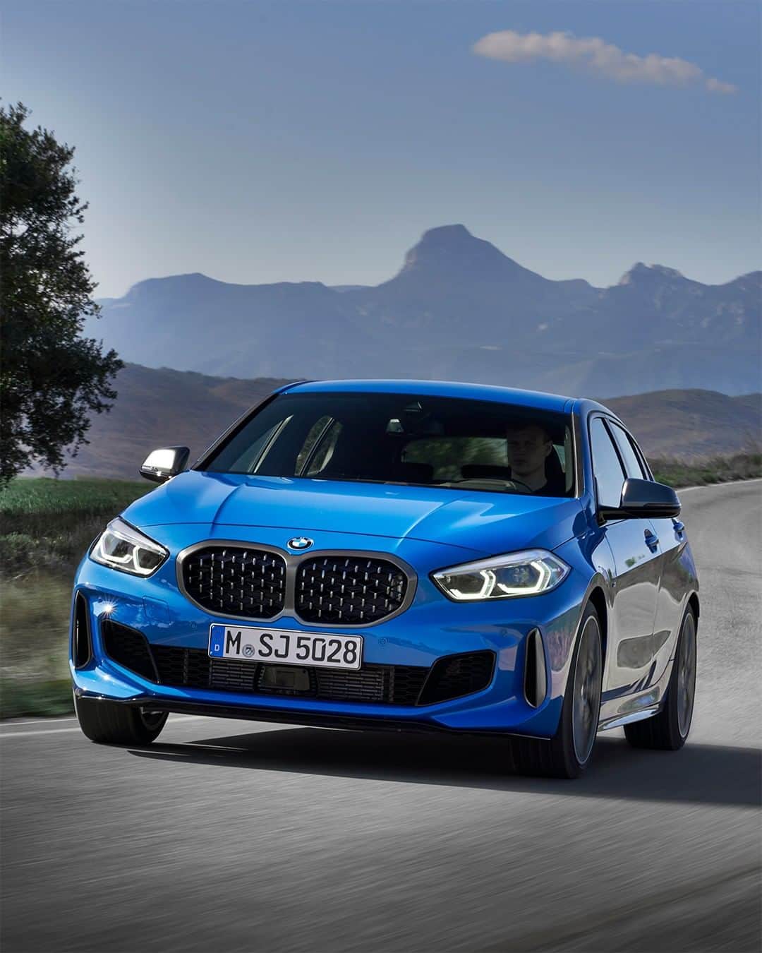 BMWのインスタグラム：「Agility and youthful enthusiasm. The all-new BMW 1 Series. #THE1 #BMW #1Series #cool #road #instatravel __ BMW M135i xDrive 5-door: Fuel consumption in l/100 km (combined): 7.1 - 6.8. CO2 emissions in g/km (combined): 162 - 155. The values of fuel consumptions, CO2 emissions and energy consumptions shown were determined according to the European Regulation (EC) 715/2007 in the version applicable at the time of type approval. The figures refer to a vehicle with basic configuration in Germany and the range shown considers optional equipment and the different size of wheels and tires available on the selected model. The values of the vehicles are already based on the new WLTP regulation and are translated back into NEDC-equivalent values in order to ensure the comparison between the vehicles. [With respect to these vehicles, for vehicle related taxes or other duties based (at least inter alia) on CO2-emissions the CO2 values may differ to the values stated here.] The CO2 efficiency specifications are determined according to Directive 1999/94/EC and the European Regulation in its current version applicable. The values shown are based on the fuel consumption, CO2 values and energy consumptions according to the NEDC cycle for the classification. For further information about the official fuel consumption and the specific CO2 emission of new passenger cars can be taken out of the „handbook of fuel consumption, the CO2 emission and power consumption of new passenger cars“, which is available at all selling points and at https://www.dat.de/angebote/verlagsprodukte/leitfaden-kraftstoffverbrauch.html.」