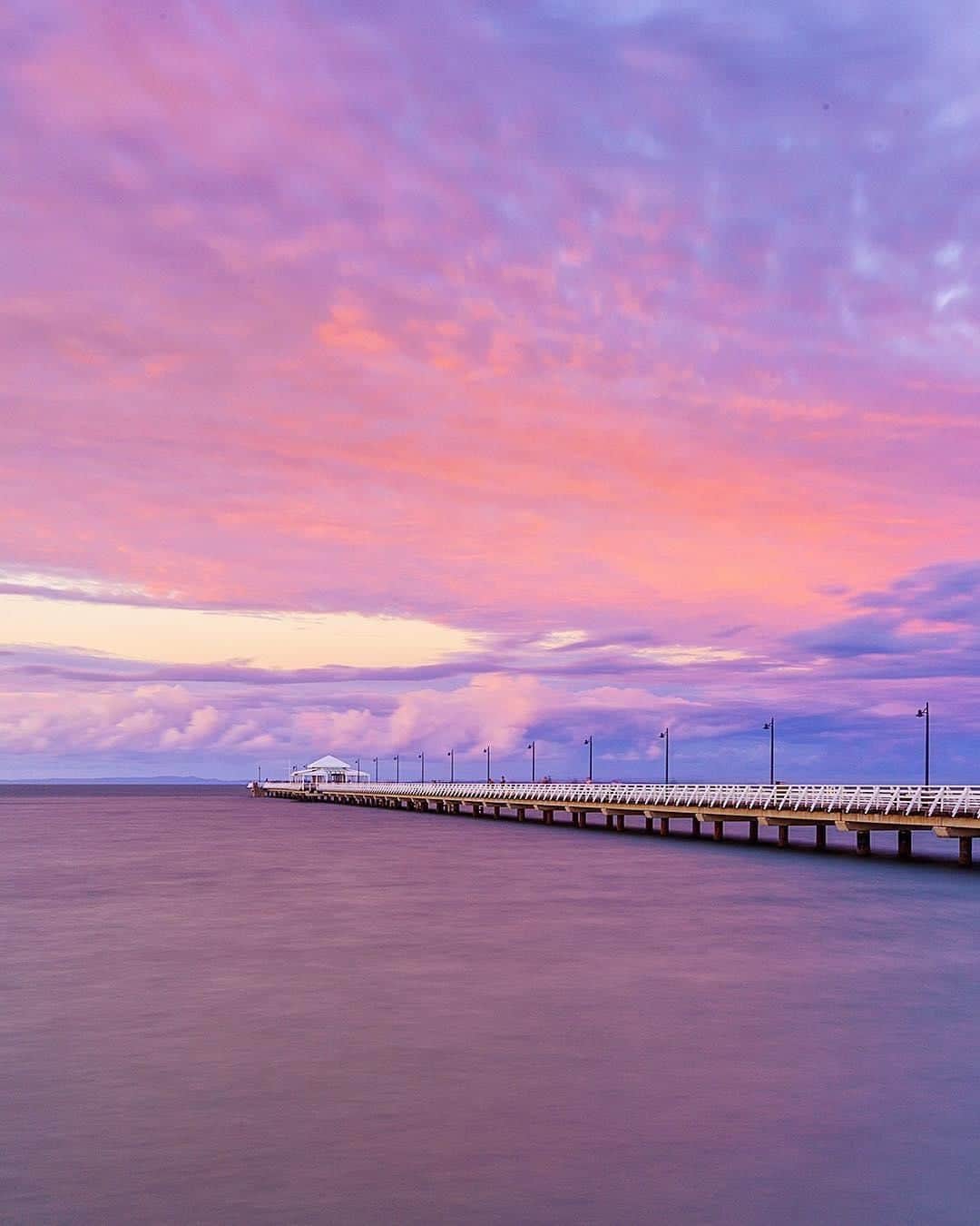 Australiaさんのインスタグラム写真 - (AustraliaInstagram)「Purple and pink make quite the perfect pair 💜 @swaller4 captured this mesmerising pastel #sunset over #ShorncliffePier on this particular evening, half an hour north of @visitbrisbane’s CBD. This @queensland suburb forms a lovely seaside village alongside #Sandgate and #Brighton, with a long stretch of sand lined with cute cafes and trendy bars. The pier is the perfect vantage point for sunrise or sunset viewing; get here nice and early for sunrise then go on a coffee crawl at @wired_owl_coffee, @matthewthomasstores and @beboldsandgate; or enjoy a seafood dinner and some drinks at @shelleyinn, @cardiganbar or @mrhendersonbar after sunset.  #seeaustralia #thisisqueensland #brisbaneanyday #sunsetlovers #travel」6月11日 20時00分 - australia