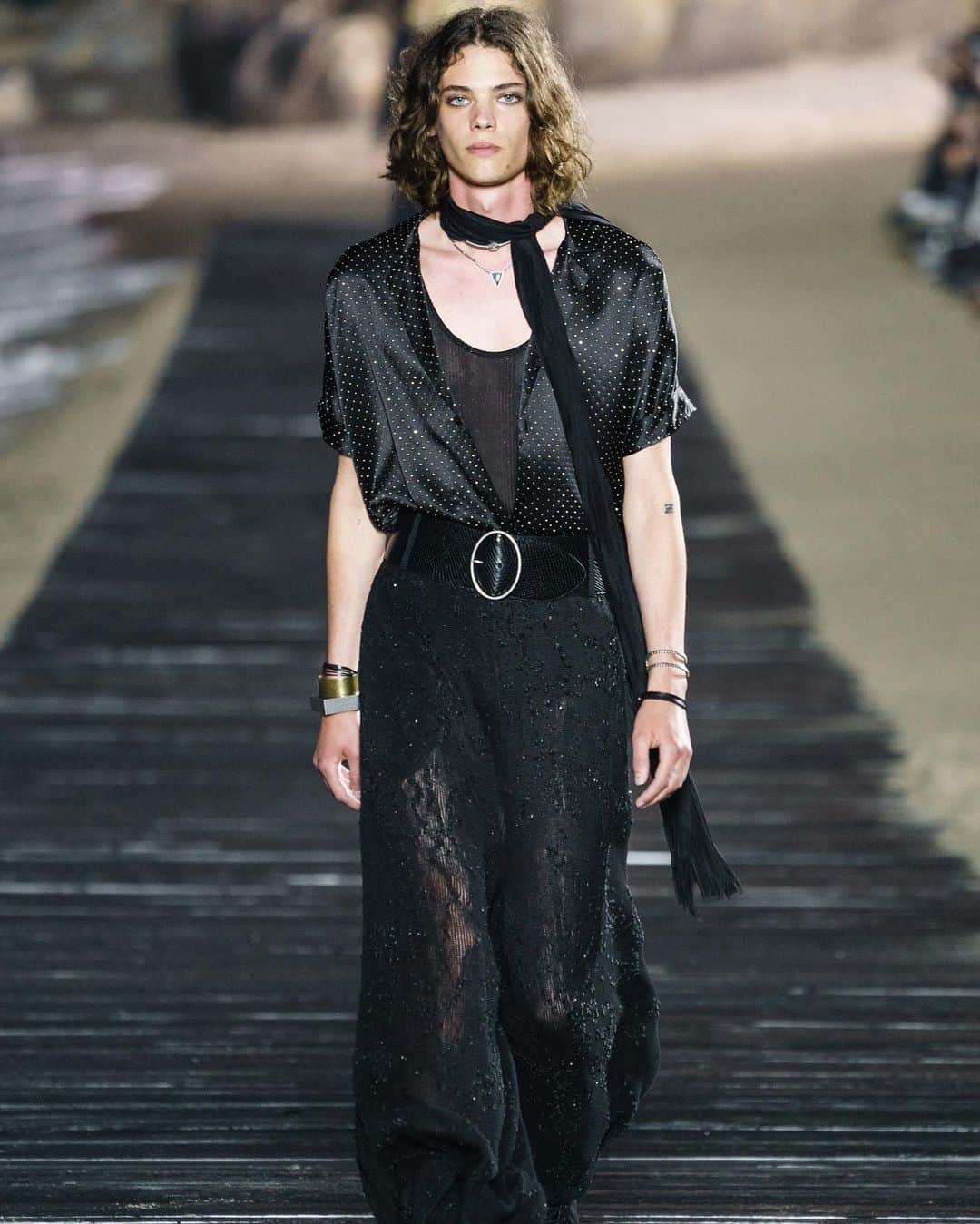 Fashion Weekのインスタグラム：「#YvesSaintLaurent designer @anthonyvaccarello took to a boardwalk atop a Malibu beach to show his @YSL Spring 2020 Menswear collection. The relaxed beach town served as inspiration for the free-spirited collection. 👈 For a look at the 70s inspired pieces.」