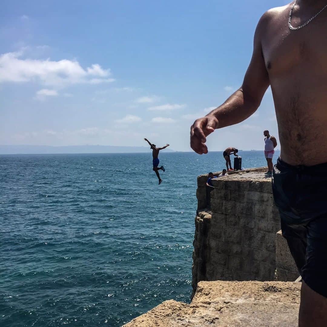 National Geographic Travelさんのインスタグラム写真 - (National Geographic TravelInstagram)「Photo by Muhammed Muheisen @mmuheisen | A person jumps into the Mediterranean Sea from the ancient wall surrounding the old city of Acre. For more photos and videos from different parts of the world, follow me @mmuheisen and @mmuheisenpublic」6月12日 10時13分 - natgeotravel