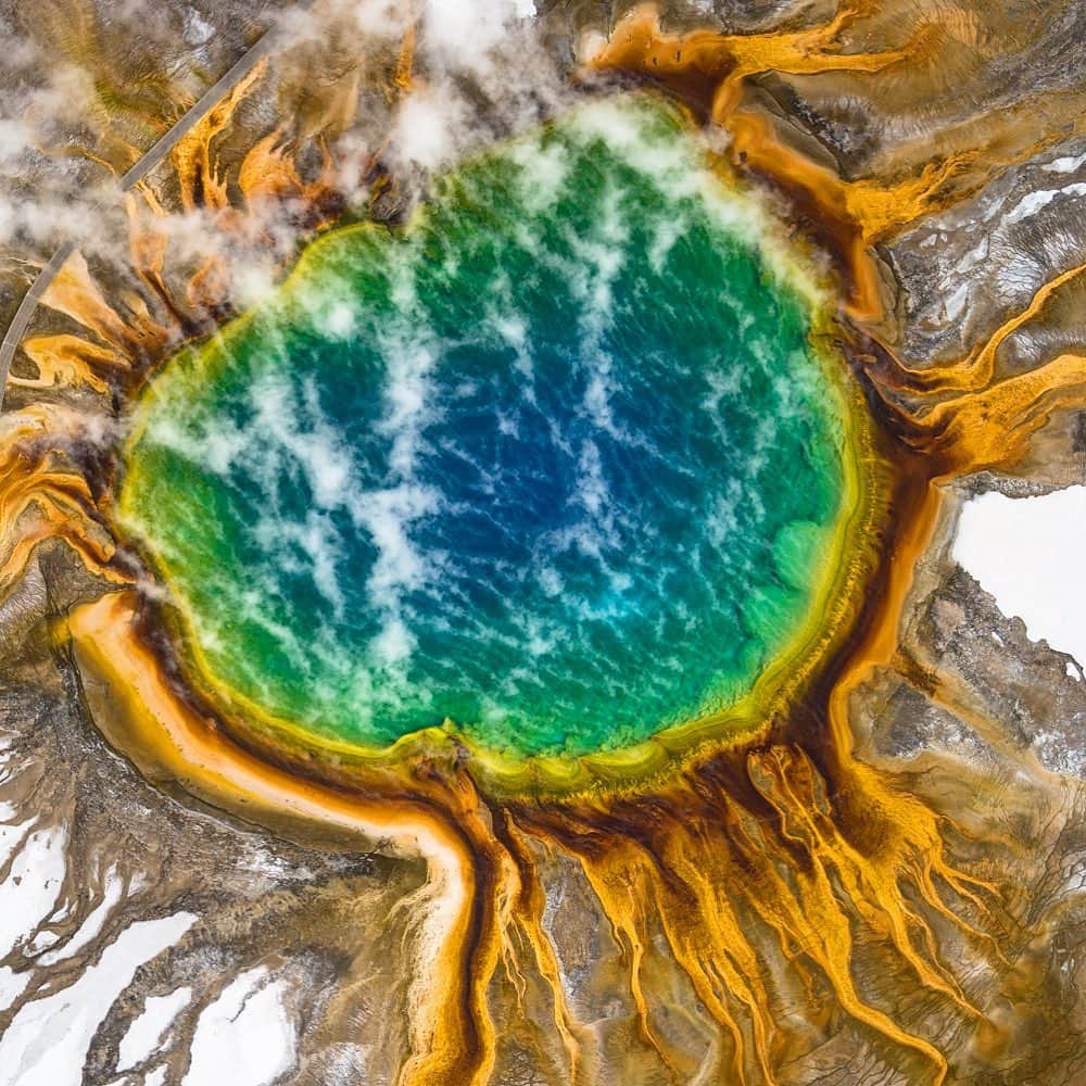 クリス・バーカードのインスタグラム：「Is there a more beautiful display of the Earth’s beating heart than the Grand Prismatic Spring from above? . This was taken a few years ago during a cold clear winter day out the window of a small 2 seater Cessna plane with a 24-70mm f2.8 lens and a circular polarizer. Sony A7rII at the time.」