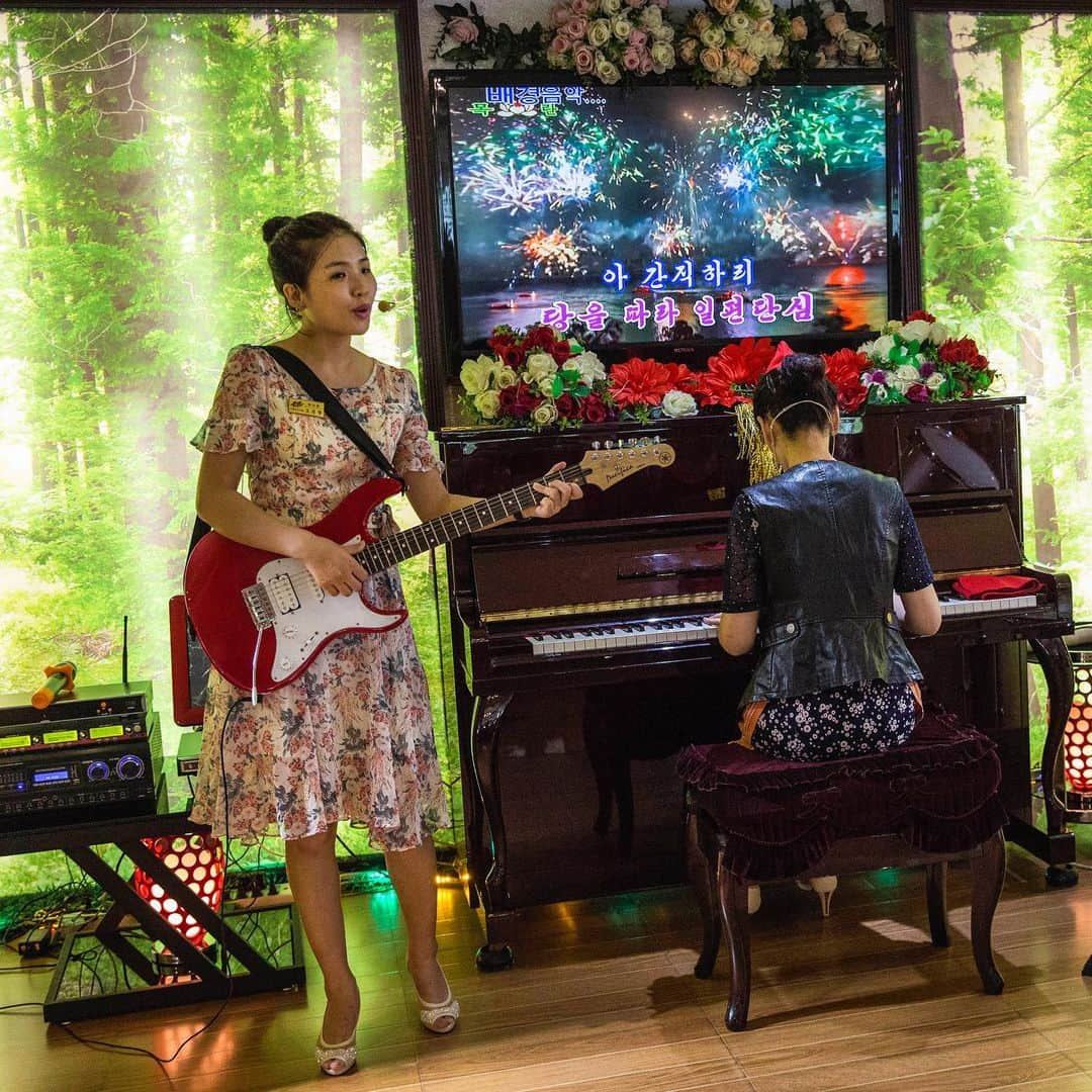 thephotosocietyさんのインスタグラム写真 - (thephotosocietyInstagram)「Photo by David Guttenfelder @dguttenfelder | An all-female rock band performs a lunchtime set at an Italian restaurant in Pyongyang, North Korea.  Please follow me, @dguttenfelder, for an inside look at North Korea, where I have been traveling and photographing for the past 19 years.」6月12日 21時26分 - thephotosociety