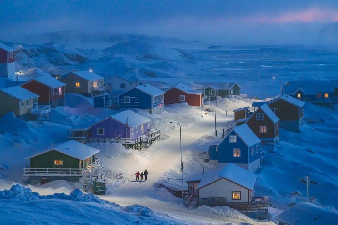 National Geographic Travelさんのインスタグラム写真 - (National Geographic TravelInstagram)「Photo by @thomaschuphoto | Announcing the grand prize-winning image for the 2019 National Geographic Photo Travel Contest. Our judges reviewed thousands of entries, and this photo of a family walking through the fishing village of Upernavik, Greenland, at dusk rose above the rest. While photographer Weimin Chu has spent time traveling throughout the Arctic nation, this was his first visit to the northwestern city. Chu recalls being overcome by emotion when he saw the city for the first time: “The beauty of this tranquil village was really beyond my imagination. It was a wow moment for me.” To see more winners, visit natgeo.com/travelphotocontest」6月12日 22時44分 - natgeotravel