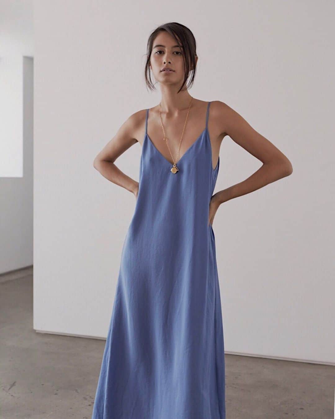のインスタグラム：「Summer evenings in the Luna Cami Dress // This silky maxi dress in dume blue features a dramatic split layered back and adjustable straps for the perfect mix of intrigue and simplicity.」