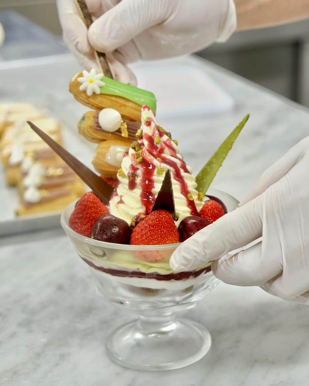 Andaz Tokyo アンダーズ 東京さんのインスタグラム写真 - (Andaz Tokyo アンダーズ 東京Instagram)「5th Anniversary Signature Parfait 🎉 🍦🍡🍓🍒 To commemorate @andaztokyo’s 5th year anniversary, the Pastry Shop is offering a celebratory parfait with all our signature sweets combined in one delicious creation. Featuring in our pistachio Sweet Jar, seasonal Mini Éclair, and pieces from our Chocolate Library, grab this parfait while it lasts! Only until June 30th!! 📺 See how it’s made in IGTV. 🌟 アンダーズ 東京の開業5周年を記念して、ペストリー ショップの3 つのシグネチャー「スイート ジャー」「エクレア」「アンダーズ チョコレート ライブラリー」を一度にお楽しみいただけるパフェが登場！6月末日まで1日10食までの限定販売です。それぞれのメニューの魅力が詰まった、欲張りなパフェをご堪能ください。（イートインのみのご提供となります。）」6月13日 22時10分 - andaztokyo