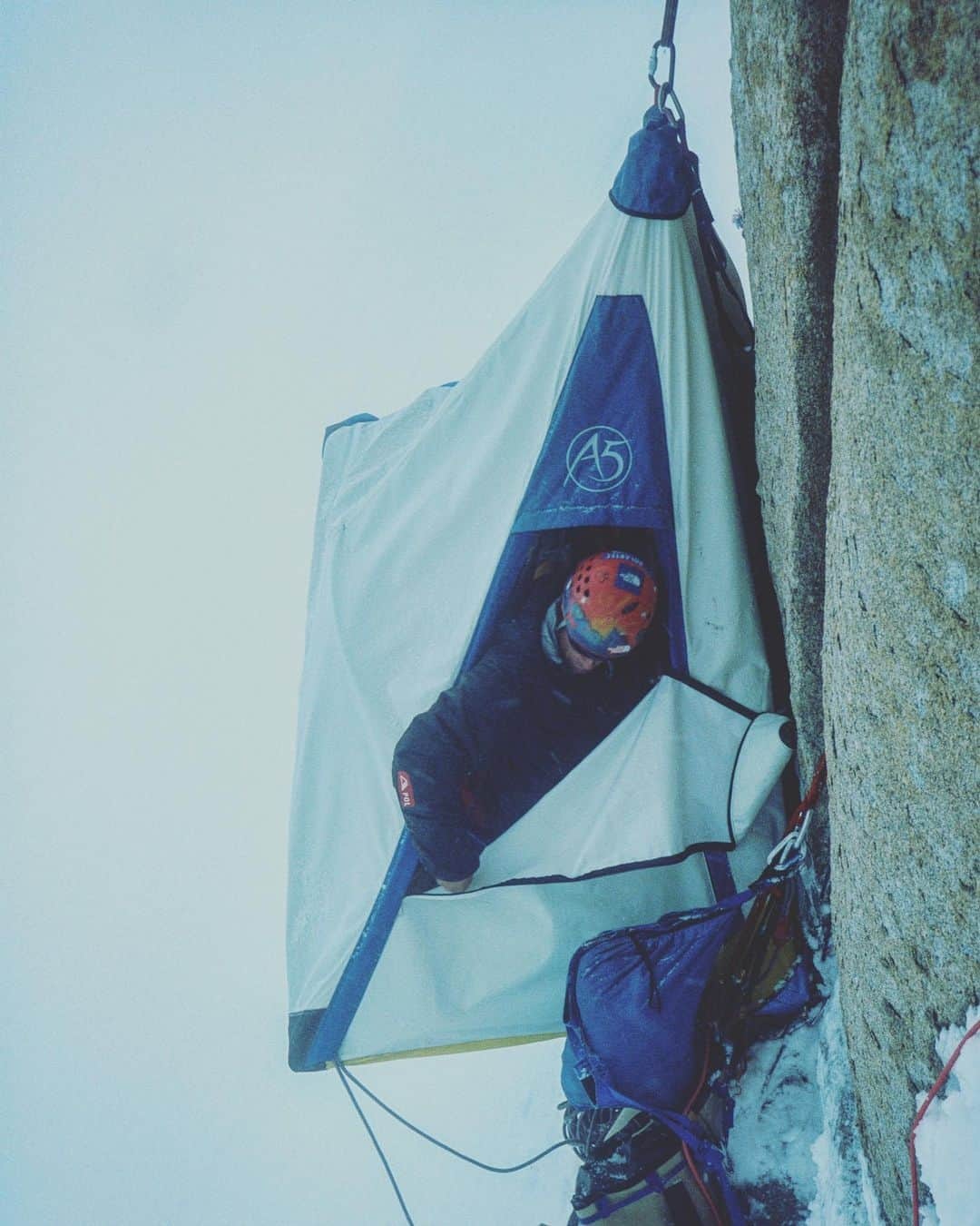 ジミー・チンさんのインスタグラム写真 - (ジミー・チンInstagram)「#tbt @conrad_anker and @brady_robinson peer out of the portaledge after a 4 day storm on K7. The living space was a crammed mashup of knees, shoulders, elbows, boots, wet socks, gloves etc. It was a sorry fetid sagging excuse of a home. A lot of people ask what three guys stuck in a two person portaledge talk about for four days. Well...not much. Nothing to do but melt snow for water and ponder life’s existential questions. @thenorthface」6月13日 22時26分 - jimmychin