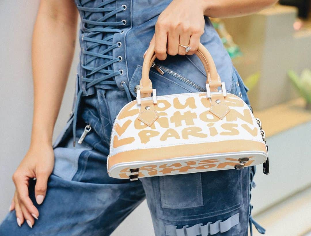 のインスタグラム：「Can you handle this? Our Louis Vuitton x Stephen Sprouse Beige Glazed Leather Graffiti Alma is a limited edition find... sourced just for you. #WearWGACA Photo: @katpage」