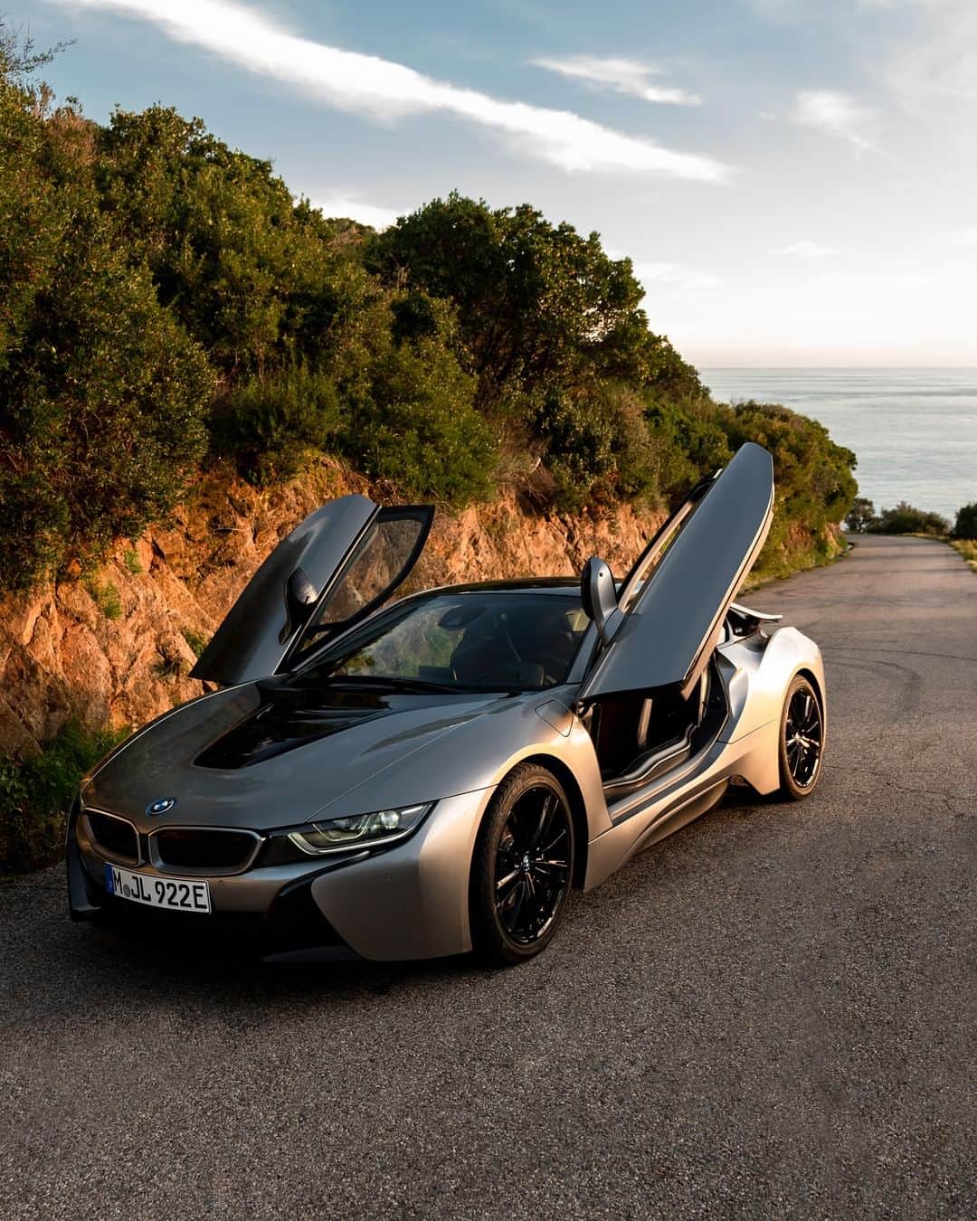 BMWのインスタグラム：「Unleashed energies of high performance. The BMW i8 Coupé. #BMWi8 #BMWi #Coupe #sea #ocean #beach #⚡️ #electricmobility  __ BMW i8 Coupé LCI: Energy consumption in kWh/100 km (combined): 14.0. Fuel consumption in l/100 km (combined): 1.8. CO2 emissions in g/km (combined): 42. The values of fuel consumptions, CO2 emissions and energy consumptions shown were determined according to the European Regulation (EC) 715/2007 in the version applicable at the time of type approval. The figures refer to a vehicle with basic configuration in Germany and the range shown considers optional equipment and the different size of wheels and tires available on the selected model. The values of the vehicles are already based on the new WLTP regulation and are translated back into NEDC-equivalent values in order to ensure the comparison between the vehicles. [With respect to these vehicles, for vehicle related taxes or other duties based (at least inter alia) on CO2-emissions the CO2 values may differ to the values stated here.] The CO2 efficiency specifications are determined according to Directive 1999/94/EC and the European Regulation in its current version applicable. The values shown are based on the fuel consumption, CO2 values and energy consumptions according to the NEDC cycle for the classification. For further information about the official fuel consumption and the specific CO2 emission of new passenger cars can be taken out of the „handbook of fuel consumption, the CO2 emission and power consumption of new passenger cars“, which is available at all selling points and at https://www.dat.de/angebote/verlagsprodukte/leitfaden-kraftstoffverbrauch.html.」