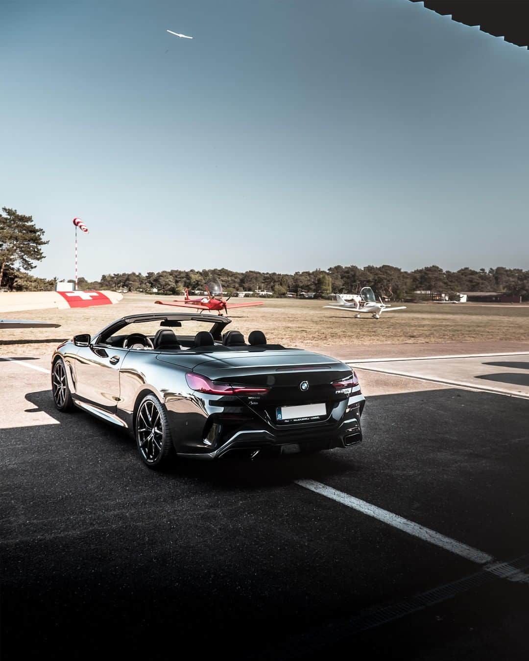 BMWのインスタグラム：「Confidence comes from within. THE 8 Convertible. #BMWrepost @itspbx @satan_m850i #THE8 #BMW #8Series #Convertible #luxurycar #automotivedesign #luxury #style #luxurylifestyle #luxurytravel #luxurydesign  __ BMW M850i xDrive Convertible: Fuel consumption in l/100 km (combined): 10.0 - 9.9. CO2 emissions in g/km (combined): 229 - 225*; *All performance, fuel consumption and emissions figures are provisional. The values of fuel consumptions, CO2 emissions and energy consumptions shown were determined according to the European Regulation (EC) 715/2007 in the version applicable at the time of type approval. The figures refer to a vehicle with basic configuration in Germany and the range shown considers optional equipment and the different size of wheels and tires available on the selected model. The values of the vehicles are already based on the new WLTP regulation and are translated back into NEDC-equivalent values in order to ensure the comparison between the vehicles. [With respect to these vehicles, for vehicle related taxes or other duties based (at least inter alia) on CO2-emissions the CO2 values may differ to the values stated here.] The CO2 efficiency specifications are determined according to Directive 1999/94/EC and the European Regulation in its current version applicable. The values shown are based on the fuel consumption, CO2 values and energy consumptions according to the NEDC cycle for the classification. For further information about the official fuel consumption and the specific CO2 emission of new passenger cars can be taken out of the „handbook of fuel consumption, the CO2 emission and power consumption of new passenger cars“, which is available at all selling points and at https://www.dat.de/angebote/verlagsprodukte/leitfaden-kraftstoffverbrauch.html.」