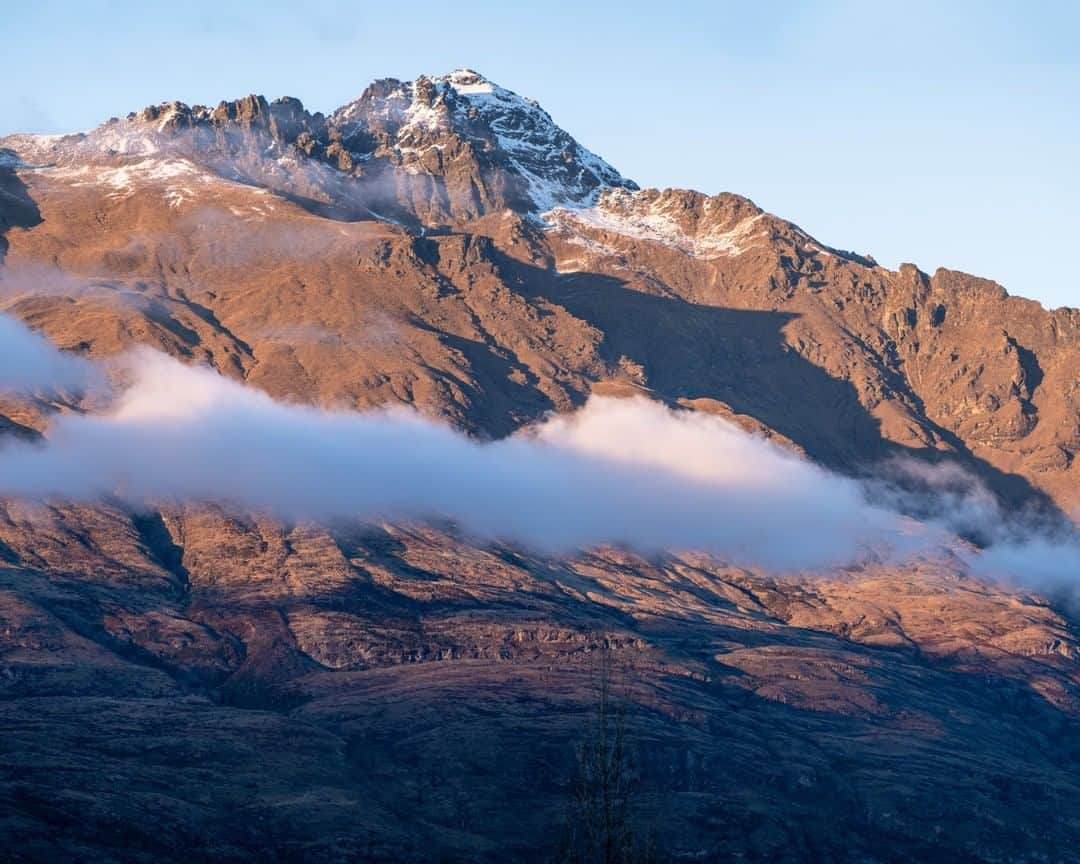 National Geographic Travelさんのインスタグラム写真 - (National Geographic TravelInstagram)「Photo by @michaelclarkphoto | Sunrise on Walter Peak above Lake  Wakatipu and Queenstown, New Zealand. While staying with some friends in Queenstown, I happened to look out the window and snapped to attention when I saw this vista. Clouds below the tops of mountains never seems to get old. Queenstown and the surrounding area is a mountain paradise. #mtwalter #queenstown #newzealand」7月16日 19時01分 - natgeotravel