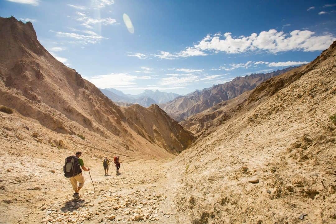 National Geographic Travelさんのインスタグラム写真 - (National Geographic TravelInstagram)「Photo by @emilypolar | Hikers make their way down a steep slope through the high altitude desert terrain in the Zanskar region of Ladakh in Northern India. To see more of Ladakh and beyond, follow me @emilypolar. #India #Zanskar #Ladakh #JammuandKashmir」7月13日 19時00分 - natgeotravel