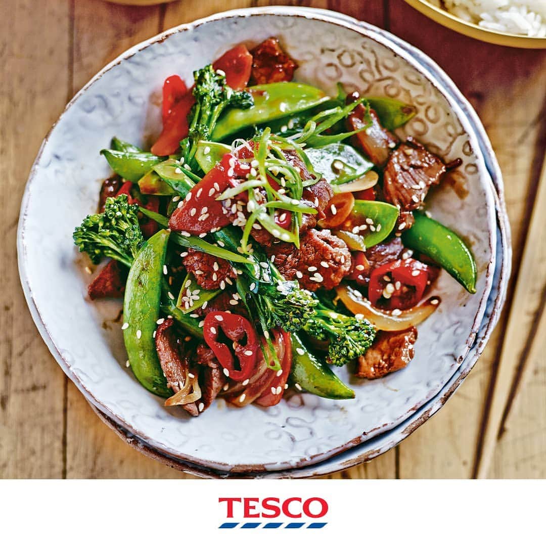 Tesco Food Officialさんのインスタグラム写真 - (Tesco Food OfficialInstagram)「It’s not just ‘dinner at home’ - stir frying is all about action! Get that beef marinating, pan sizzling and fresh veg moving with a fast and healthier #FakeAway favourite.  Ingredients 400g (13oz) fillet or sirloin steak, cut into thin slices 1 1/2 tbsp light soy sauce 1 tbsp dry sherry or rice wine 15ml (1 tbsp) sesame oil 2 tsp cornflour 2 tbsp groundnut oil 1 onion, thickly sliced 1 carrot, thinly chopped 2 cloves garlic, thinly sliced 100g (3 1/2oz) Tenderstem broccoli 100g (3 1/2oz) mangetout 100g (3 1/2oz) sugar snap peas 1 long red chilli, thinly sliced 15ml (1 tbsp) oyster sauce 2 spring onions, thinly sliced steamed jasmine rice  Method 1. Place the beef in a bowl and pour over the soy sauce, rice wine or sherry, sesame oil and cornflour. Season well, mix together and marinate for 20 minutes. 2. Heat half of the groundnut oil in a wok. When it begins to smoke, remove the beef from the marinade with a slotted spoon and add to the pan. Stir-fry the beef for 2-3 minutes, then tip onto a plate. 3. Clean the wok with a paper towel, and return it to the heat with the remaining oil. Add the onion and carrot. Cook for 2 minutes. Add the garlic, broccoli, mangetout, sugar snaps, and water to steam. 4. Once the water has evaporated, add the cooked beef, red chilli, oyster sauce and marinade. Cook for 30 seconds and remove from the heat. Serve over steamed rice and garnish with the spring onions.」7月13日 21時06分 - tescofood