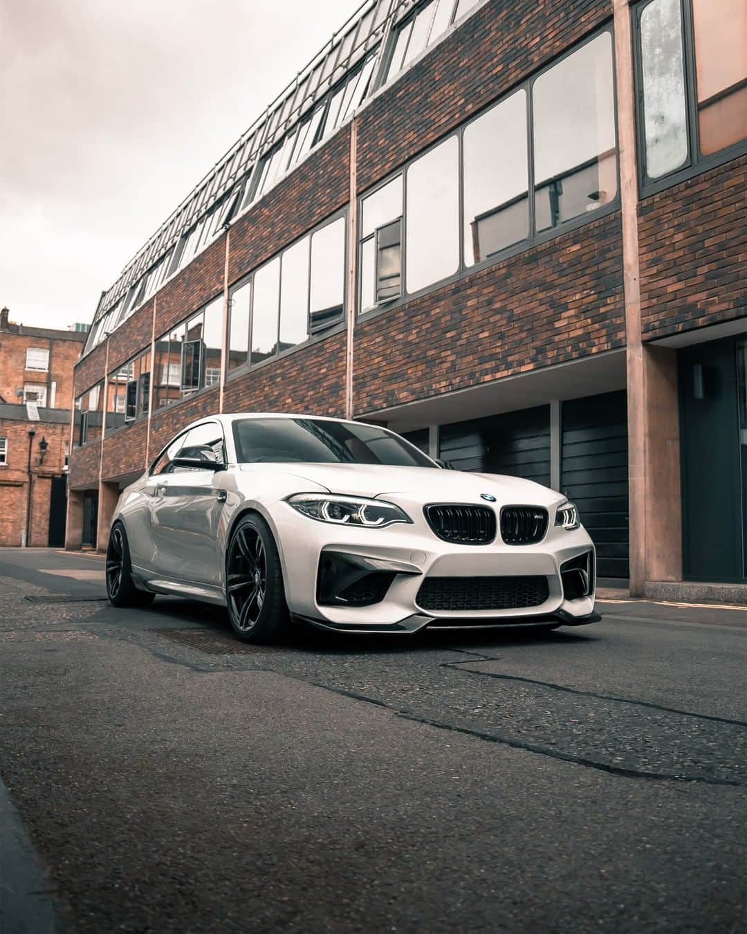 BMWのインスタグラム：「Do you want to come out and play? The BMW M2 Coupé. #TheM2 #BMW #M2 #BMWM #BMWrepost  @tcsgodfrey @dylan.autos __ BMW M2 Coupé: Fuel consumption in l/100 km (combined): 8.5. CO2 emissions in g/km (combined): 199. The values of fuel consumptions, CO2 emissions and energy consumptions shown were determined according to the European Regulation (EC) 715/2007 in the version applicable at the time of type approval. The figures refer to a vehicle with basic configuration in Germany and the range shown considers optional equipment and the different size of wheels and tires available on the selected model. The values of the vehicles are already based on the new WLTP regulation and are translated back into NEDC-equivalent values in order to ensure the comparison between the vehicles. [With respect to these vehicles, for vehicle related taxes or other duties based (at least inter alia) on CO2-emissions the CO2 values may differ to the values stated here.] The CO2 efficiency specifications are determined according to Directive 1999/94/EC and the European Regulation in its current version applicable. The values shown are based on the fuel consumption, CO2 values and energy consumptions according to the NEDC cycle for the classification. For further information about the official fuel consumption and the specific CO2 emission of new passenger cars can be taken out of the „handbook of fuel consumption, the CO2 emission and power consumption of new passenger cars“, which is available at all selling points and at https://www.dat.de/angebote/verlagsprodukte/leitfaden-kraftstoffverbrauch.html.」