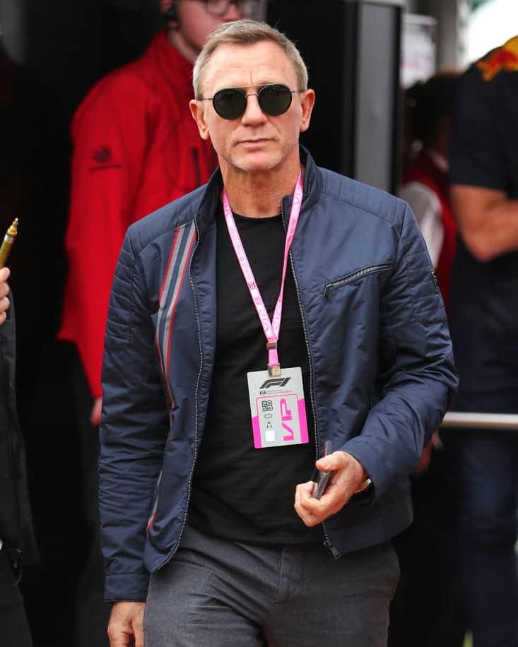 ハケットのインスタグラム：「Clocked off for the weekend; Daniel Craig aka 007 looking neither shaken nor stirred, wearing the Hackett London x Aston Martin Racing moto jacket whilst enjoying the excitement of the British GP today. Photo credit: David Davies @gettyimages  #hackett #Silverstone #F1 #licencetothrill #BritishGP #F1007」