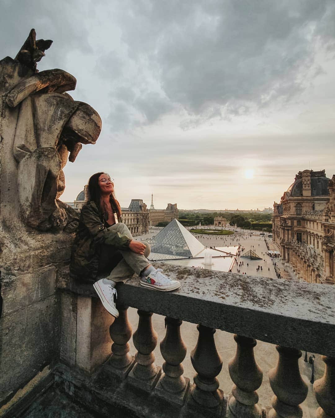Putri Anindyaのインスタグラム：「Thankful // when I was a kid, I have that lesson in the elementary school in Indonesia where I learnt about 7 wonders of the world (today they have different list). One of the wonders that caught my eyes was Eiffel Tower because it looks so simple yet elegant and long lasting design. From that moment, I have a dream to see Eiffel Tower and Paris.  I looked up about this city and amazed by the arts and cultures there then I promised myself to visit this museum too. Years gone by and fate brings me here. Sitting on the top of the Louvre museum with @capra311 who made everything possible for me to be here. Sometimes life is weird, and hard, and I feel lost lots of times but keep on dreaming cause it doesn't cost a thing and universe somehow will make a way to make it comes true for those who believe :') . . Taken by @capra311 // with permission and invitation from @museelouvre #30ansPyramide. Merci beaucoup ❤️」