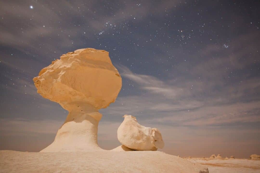 National Geographic Travelさんのインスタグラム写真 - (National Geographic TravelInstagram)「Photo by George Steinmetz @geosteinmetz | The half moon rose around 11 p.m. while I slept out in the White Desert of Farafra, Egypt. The bedrock here is composed of soft, white chalk that has been sculpted by strong winds into strange and beautiful shapes. To explore more of our world, follow me @geosteinmetz.」7月14日 22時00分 - natgeotravel