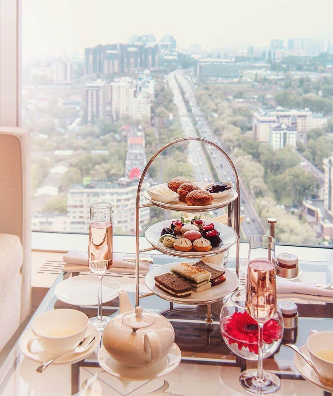 リッツ・カールトンさんのインスタグラム写真 - (リッツ・カールトンInstagram)「Delicious treats, served with a view. Elevate your next getaway at The Ritz-Carlton, #Almaty. ⁣⁠ ⁣⁠ #Kazakhstan #CityView #Cityscape #Skyline #RoomWithAView #View #InstaFood #Delicious #AfternoonTea #Dessert #Wine #Tea #Afternoon #Travel #Travelgram #InstaTravel #TravelDiaries #RCPartner via – @viv_li」7月15日 9時00分 - ritzcarlton