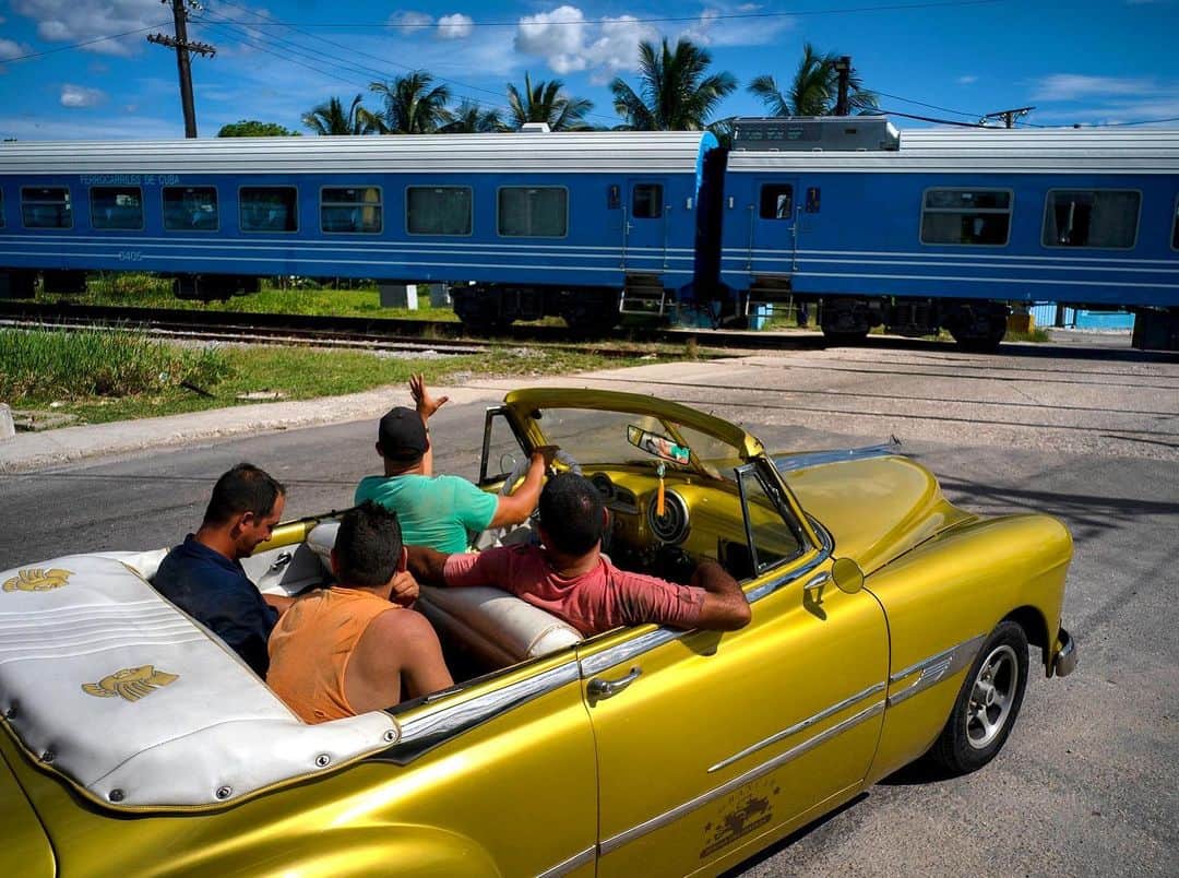 NBC Newsさんのインスタグラム写真 - (NBC NewsInstagram)「A driver in an American classic car waves as the first train using new equipment from China rides past, in Havana, Cuba on Saturday. . The first train using new equipment from China pulled out of Havana Saturday, hauling passengers on the start of a 516-mile journey to the eastern end of the island as the government tries to overhaul the country's aging and decrepit rail system. . 📷 @aprespinosa / @apnews」7月16日 7時57分 - nbcnews