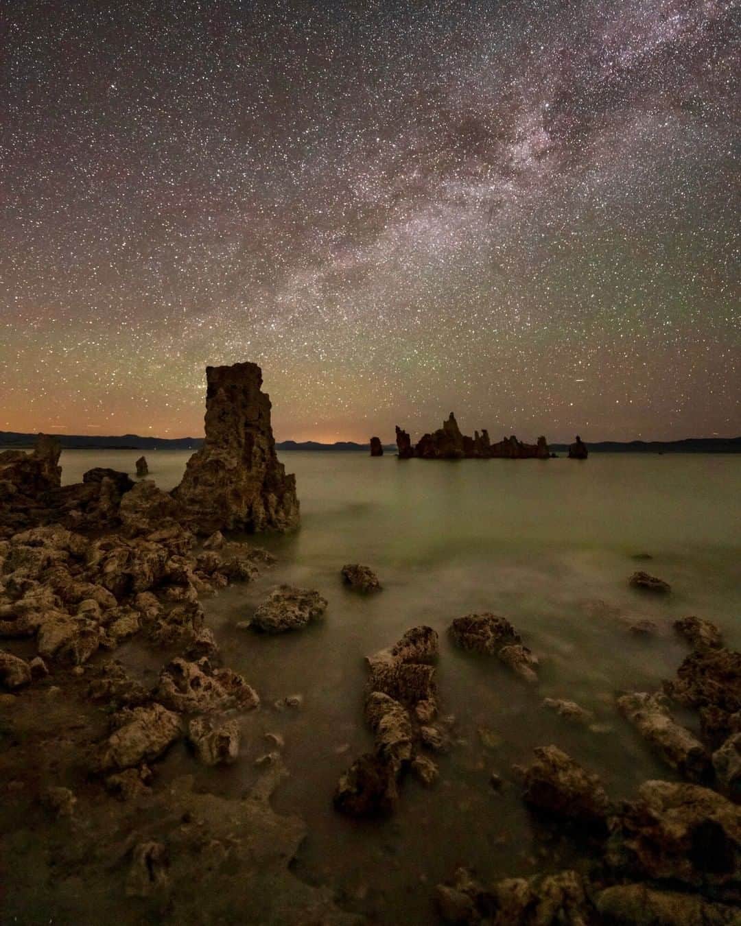 National Geographic Travelさんのインスタグラム写真 - (National Geographic TravelInstagram)「Photo by @BabakTafreshi | With billions of stars that host planets in our galaxy, there are endless possibilities of other worlds habitable to some sort of life. This singe-exposure photograph of Mono Lake looking at a little island of tufa was taken far from light pollution in California. These limestone towers are formed by the precipitation of carbonate minerals in water. Mono Lake has no outlet, so the trapped salt made the lake very alkaline and salty. But the lake has an unusually productive ecosystem, including a strange bacteria that has been deeply analyzed by astrobiologists studying the possibility of life in other worlds with extreme conditions. Explore more of The World at Night photography with me, @babaktafreshi. #saveournightsky #twanight #monolake #nightphotography」7月16日 10時00分 - natgeotravel