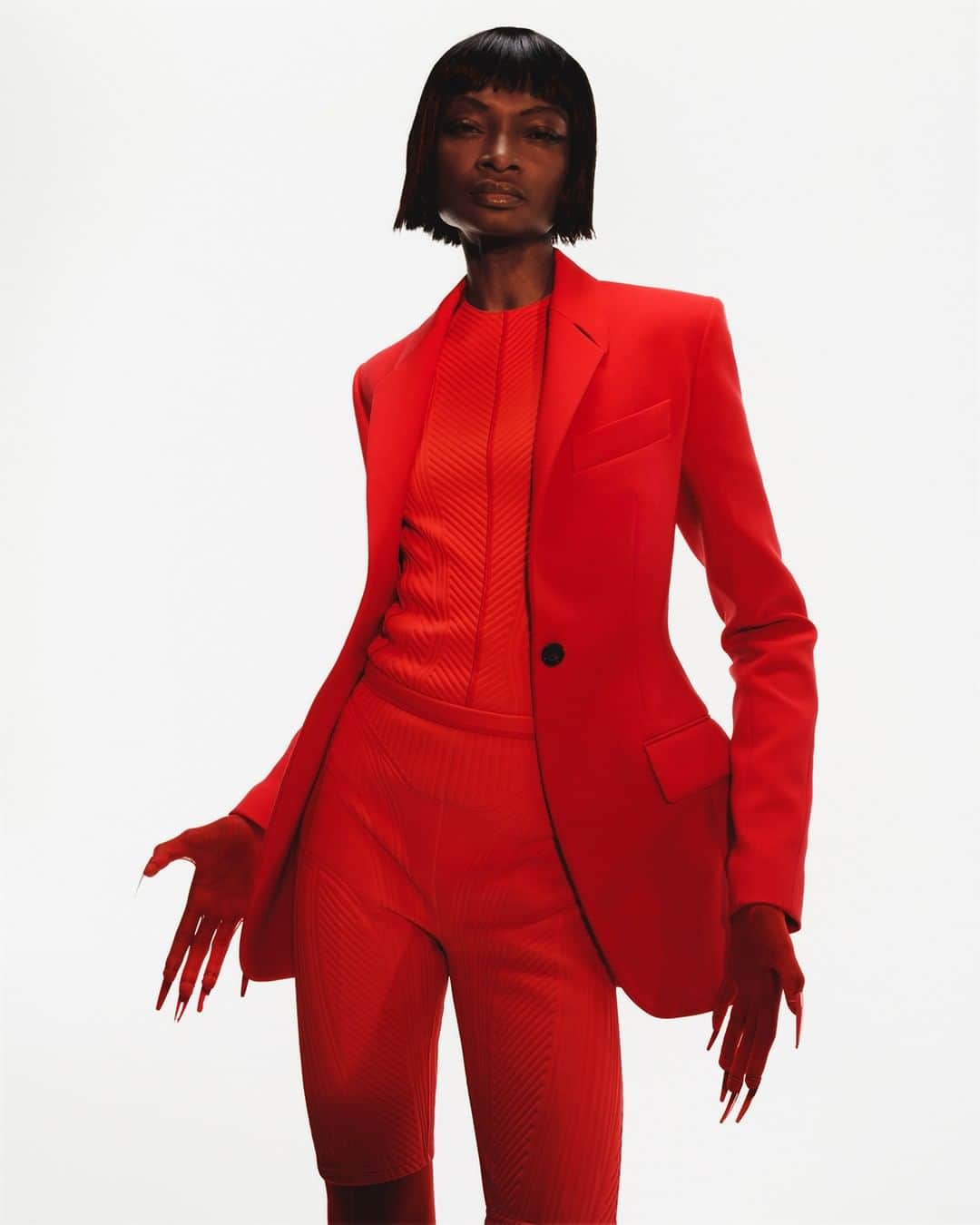 のインスタグラム：「Debra Shaw, american model, singer/songwriter and advocate for diversity in fashion based in Paris, for Mugler Resort 2020. - Debra wears an iconic red tailored jacket over a red embossed jersey top with matching cycling shorts, red nail rings over red sheer gloves. - Creative Director @cadwallader  Styling @alex_jordan_harrington  Photography @arnaudlajeunie  Casting @julialangecasting  Hair @jondefranc  Make up @christinecorbel  Movement @jordandrobson  Production @kitten_production  Model @madamedebrashaw #mugler」