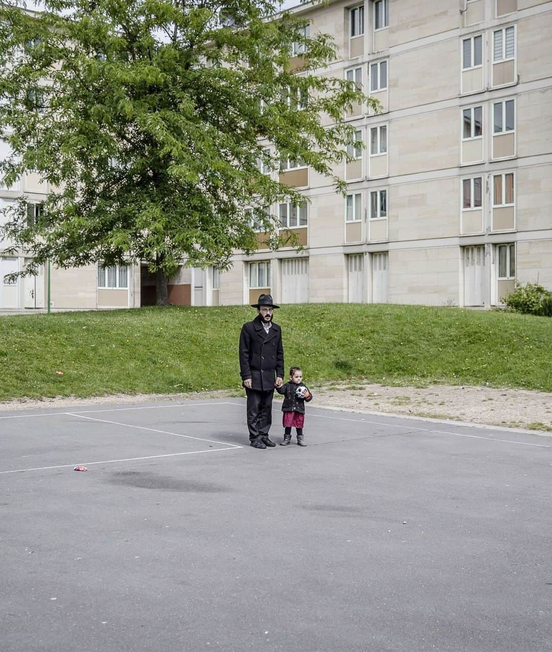 TIME Magazineさんのインスタグラム写真 - (TIME MagazineInstagram)「Marc Robbs and his daughter, Tehila-Rahel, two, in the Jewish quarter of Sarcelle, outside Paris. In #France, with the world’s third biggest Jewish population, government records showed a 74% spike in anti-Semitic acts between 2017 and 2018. And yet, for all the grim statistics, there are signs of hope across #Europe. As anti-Semitism has risen, the fight against it has intensified, both among regular Europeans and their politicians. E.U. leaders now describe the battle as one they cannot afford to lose, as though it encapsulates the struggle for Europe’s very soul, writes Vivienne Walt. “Anti-Semitism is a negation of what France is,” French President Emmanuel Macron said in February, after visiting a Jewish cemetery where swastikas had been daubed on some 80 graves. Read more about how Europe's Jews are resisting a rising tide of anti-Semitism at the link in bio. Photograph by @magnuswennman for TIME」6月24日 7時24分 - time