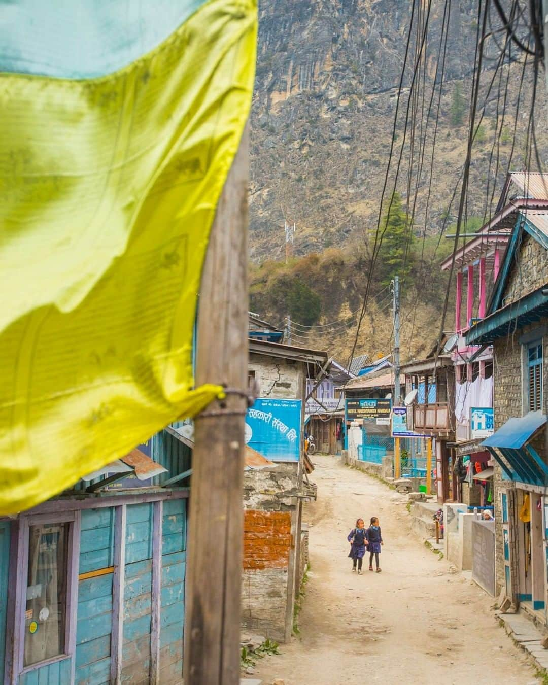 National Geographic Travelさんのインスタグラム写真 - (National Geographic TravelInstagram)「Photo by @emilypolar | Two young Nepali girls walk home from school in the village of Chame in the Manang District, the lowest populated district in Nepal. To see more of Nepal and beyond, follow me, @emilypolar. #Nepal #Chame #Himalaya」6月24日 10時03分 - natgeotravel