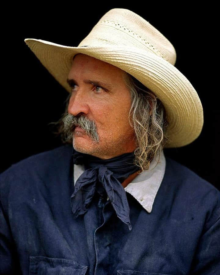 National Geographic Travelさんのインスタグラム写真 - (National Geographic TravelInstagram)「Photo by Aaron Huey @argonautphoto | Duke Pederson, a cowboy I photographed near Glasgow, Montana, was a quiet, gentle giant of a man. Big enough that he could have lifted me with one hand and thrown me 20 feet if he’d wanted. This legendary cowboy controlled his cattle dogs with the slightest hand signals from a hundred meters away and was the steward of thousands upon thousands of acres of North East Montana - a land covered in grass, cows, snakes, and bones. I'm not quite sure what's become of him. I hope he's still out there riding through all that beauty. To see more images from the American West follow me, @argonautphoto.」6月24日 22時10分 - natgeotravel