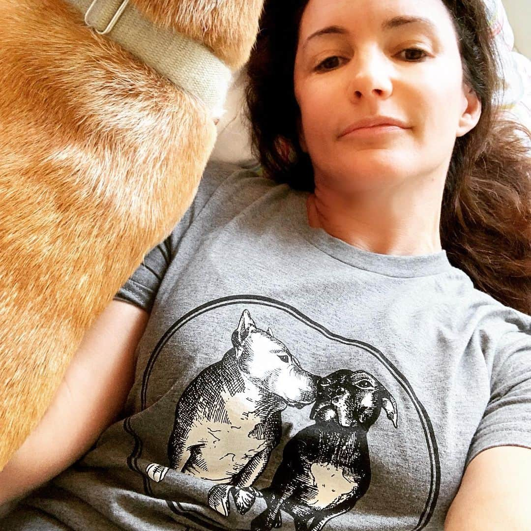 クリスティン・デイヴィスさんのインスタグラム写真 - (クリスティン・デイヴィスInstagram)「I ‘m so excited to have my @mister_todd_ and Sally  t shirt from @standupforpitsfoundation . I’m not excited about the ongoing health battles Sally is going through , due to her over breeding and neglect before @rebeccacorry rescued her. But I am thrilled to wear Todd+ Sally, with their sweet doggy kiss! I did get a kiss from Momma while trying to take this picture , but I thought that might too much for you guys . 😉  Please support @standupforpitsfoundation and so many other great people doing the difficult work and emotionally ( and financially) draining work of taking care of the millions of dogs and cats who are neglected and abandoned in our country.  #dogsofinstagram #pitbullsofinstagram #rescuedog #rescuedogsofinstagram」6月25日 2時28分 - iamkristindavis