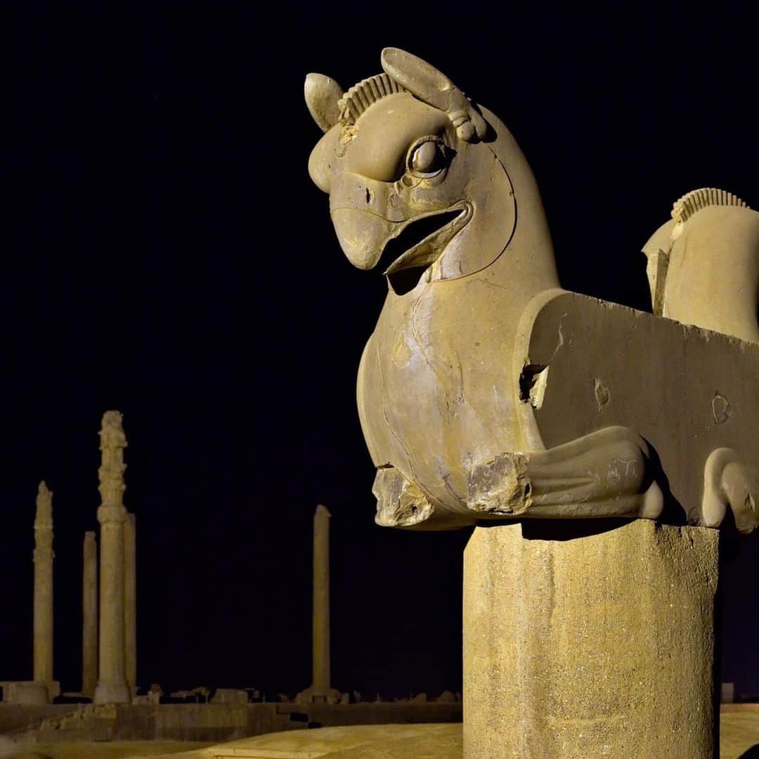 National Geographic Travelさんのインスタグラム写真 - (National Geographic TravelInstagram)「Photo by @BabakTafreshi | Swipe left to see this panoramic night view in Persepolis, Iran. A griffin statue (Homa bird in Persian mythology) appears against the backdrop of the Apadana palace and the Gate of Xerxes on the right. The griffin is a legendary creature in myths, part lion and part eagle. Persepolis is a 2500-year-old World Heritage Site of ancient palaces and temples near Shiraz. It was the ceremonial capital of the Persian Empire during the Achaemenid dynasty. Explore more of The World at Night with me, @babaktafreshi. #persepolis #shiraz #worldheritage」6月27日 4時49分 - natgeotravel