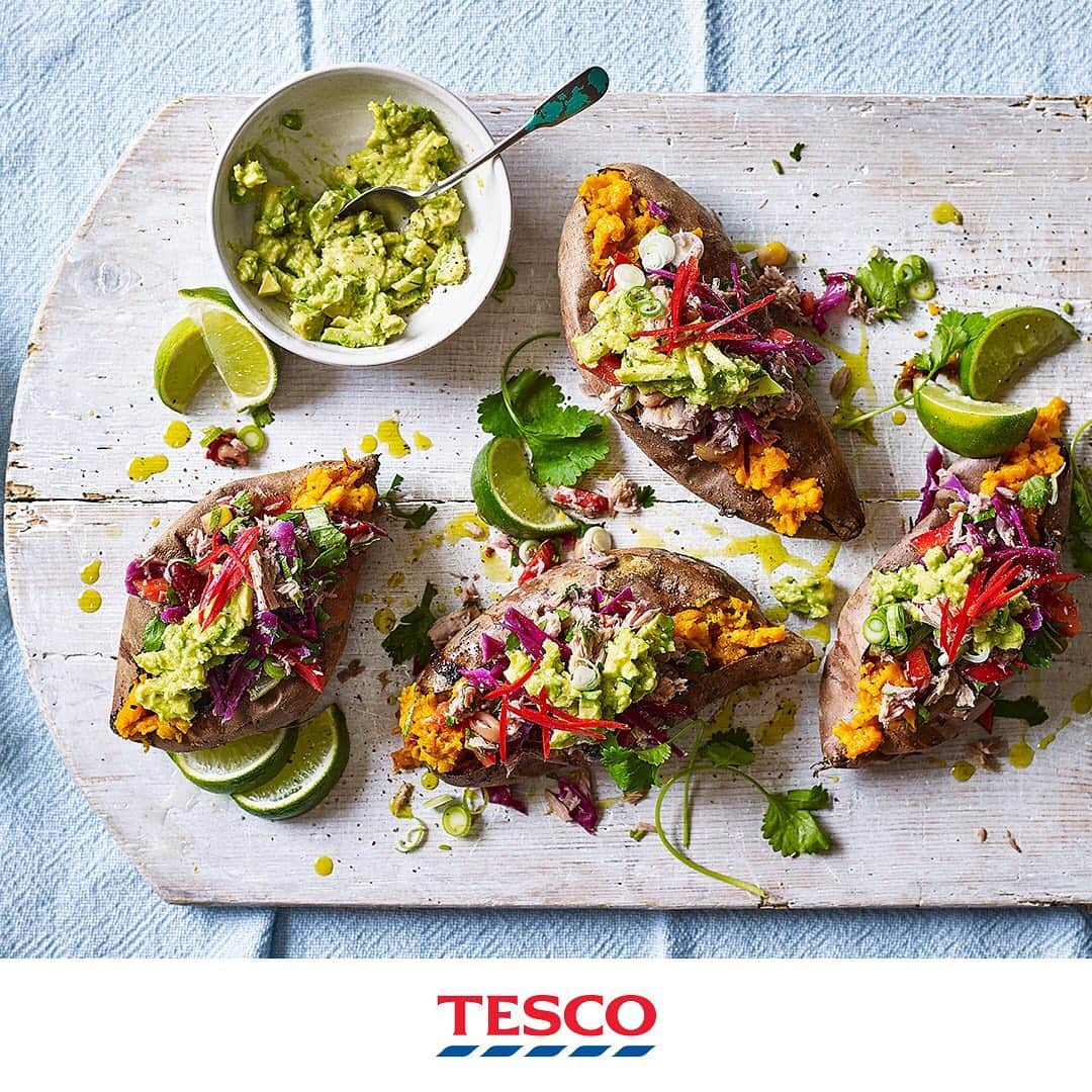 Tesco Food Officialさんのインスタグラム写真 - (Tesco Food OfficialInstagram)「A colourful salsa adds music to any meal - just look at how it lights up these baked sweet potatoes. A healthy midweek dinner for the family with loads of zing and crunch.  Ingredients 4 sweet potatoes 1 ripe avocado, stoned, peeled and mashed with a fork 1 red chilli, sliced into strips (optional) For the salsa 2 x 160g tins tuna chunks in spring water, drained 1 red pepper, diced 15g fresh coriander, roughly chopped 2 limes, zested and juiced, plus 1 cut into wedges to serve (optional) ¼ red cabbage, finely shredded 400g tin mixed bean salad, drained  Method Preheat the oven to gas 6, 200°C, fan 180°C. Pierce the sweet potatoes a few times with a fork and bake for 45 mins or until tender. Mix the salsa ingredients in a large bowl, reserving a little of the coriander; season. Split open the sweet potatoes, divide the salsa between them and dollop over the smashed avocado. Garnish with the remaining coriander, lime wedges and chilli (if using) to serve.」6月26日 23時52分 - tescofood