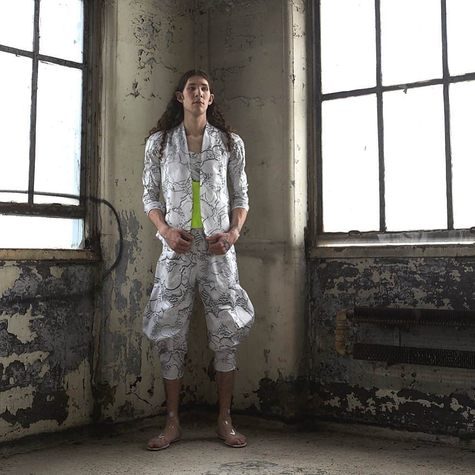 スリーアズフォーのインスタグラム：「Happy to introduce our latest resort 2020 collection: “Danakil”  featuring @thestretchh photography by: @elisabet_davidsdottir  hair by @kazukatahira  makeup by @miki_ishikura threeASFOUR welcomes  2020 with an increasing concern about climate change ... in these precarious times the question of how life started on Earth becomes extremely precious. This quest has led the first scientific expedition into the hellish environment of the Dallol salt dome in the Danakil Desert in Ethiopia.  Life – in the form of single-celled organisms – appeared on Earth around 3.8 billion years ago, during the Archean eon, as the Earth’s crust first began to poke out of the sea. In this hot, acidic and volcanic environment, geology prevailed over biology – much like it does in Dallol. #resort #resort2020 #2020 #fashion  #Danakil #climatechange change shot at @manacontemporary Fabric print featuring @stanleycasselman1 paintings .」