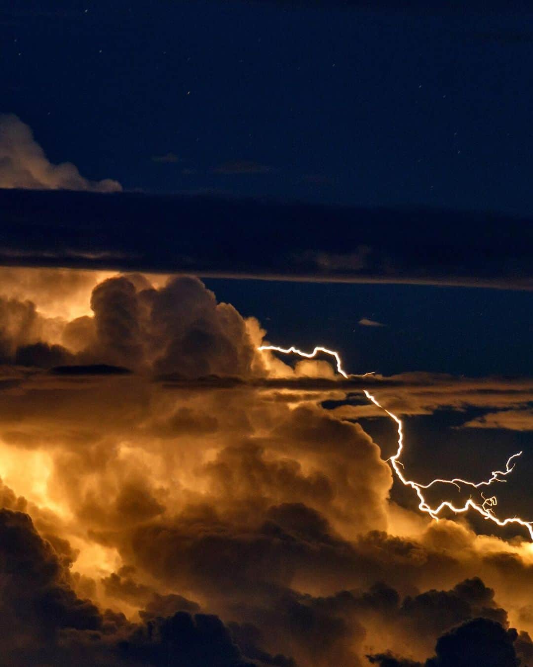 ナショナルジオグラフィックさんのインスタグラム写真 - (ナショナルジオグラフィックInstagram)「Photo by Babak Tafreshi @babaktafreshi | The magnificent power of nature: Slowly swipe left to see the entire view of this telephoto image of a thunderstorm, as seen from the island of Maui in the early evening hours. Explore more of the World at Night photography with me @babaktafreshi. #Hawaii #weather #thunderstorm #nightphotography」6月28日 0時38分 - natgeo
