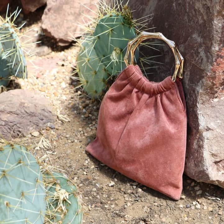アクセサライズのインスタグラム：「Define your evening look with glamour thanks to our Paulina pouch bag. Made from soft suedette, this endlessly chic style is carried by metal ring handles with a high-fashion bamboo effect. 🔍 7905737000  Tap the link in the bio to shop now.  #Accessorize」