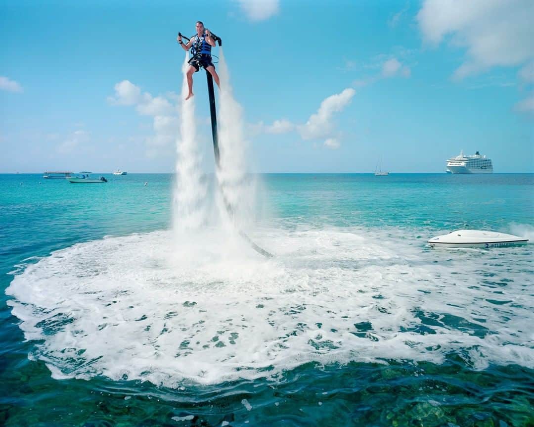National Geographic Travelさんのインスタグラム写真 - (National Geographic TravelInstagram)「Photo by Gabriele Galimberti @gabrielegalimbertiphoto and Paolo Woods @paolowoods | An employee of Jetpack Cayman demonstrates this new water sport, now available on the island. A 2000cc motor pumps water up through the jetpack, propelling the client out of the sea. #cayman #grandcayman #sea」6月28日 16時00分 - natgeotravel