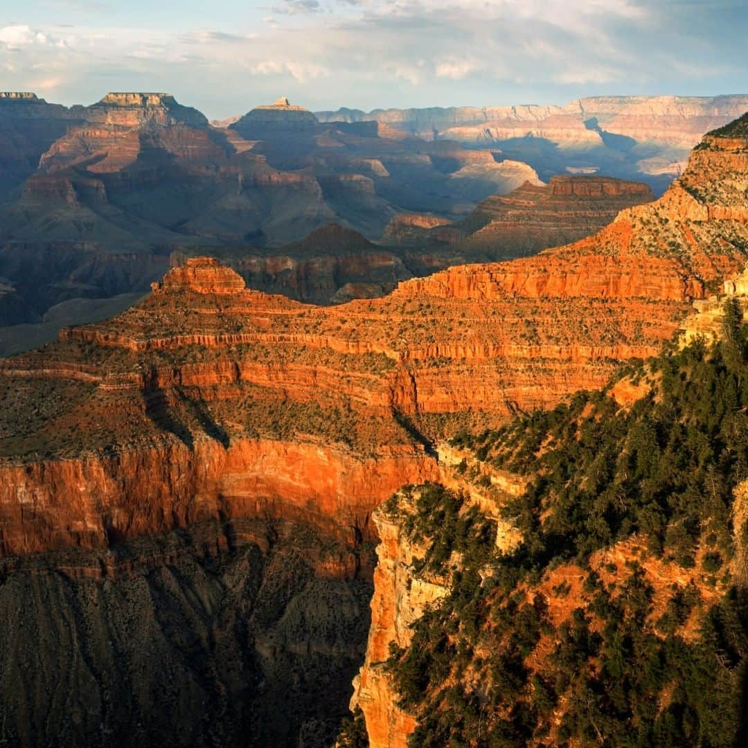 アメリカ内務省さんのインスタグラム写真 - (アメリカ内務省Instagram)「An overwhelming labyrinth of striped stone walls and rugged rock formations, the Grand Canyon is 277 river miles long, up to 18 miles wide and a mile deep. Viewed from Yavapai Point on the South Rim at sunset, the rugged landscape shows layers of glowing rocks and spreading shadows. Carved by water and wind over the last 6 million years, the canyon reveals basement rocks that were formed over 1.8 billion years ago. So as your eyes move across the large distances of this fascinating place, they’re also traveling through layers of time. Photo taken at #GrandCanyon National Park (@grandcanyonnps) last week by M.Quinn, #NationalPark Service. #Arizona #FindYourPark #travel #usinterior」6月29日 9時15分 - usinterior